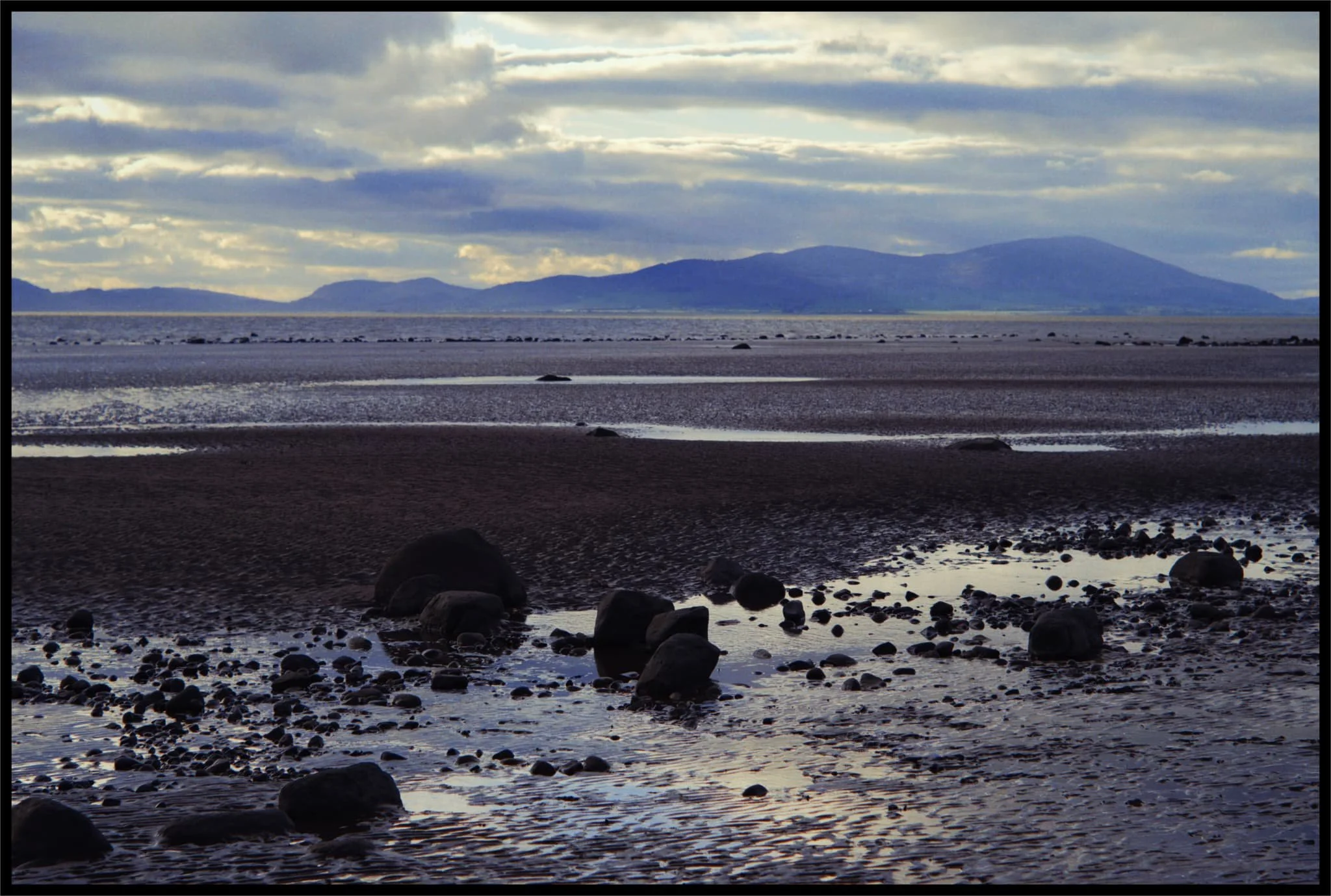  Across the sea, as the sun was setting, Criffel hill is clearly seen as it looms over the Scottish coast. 