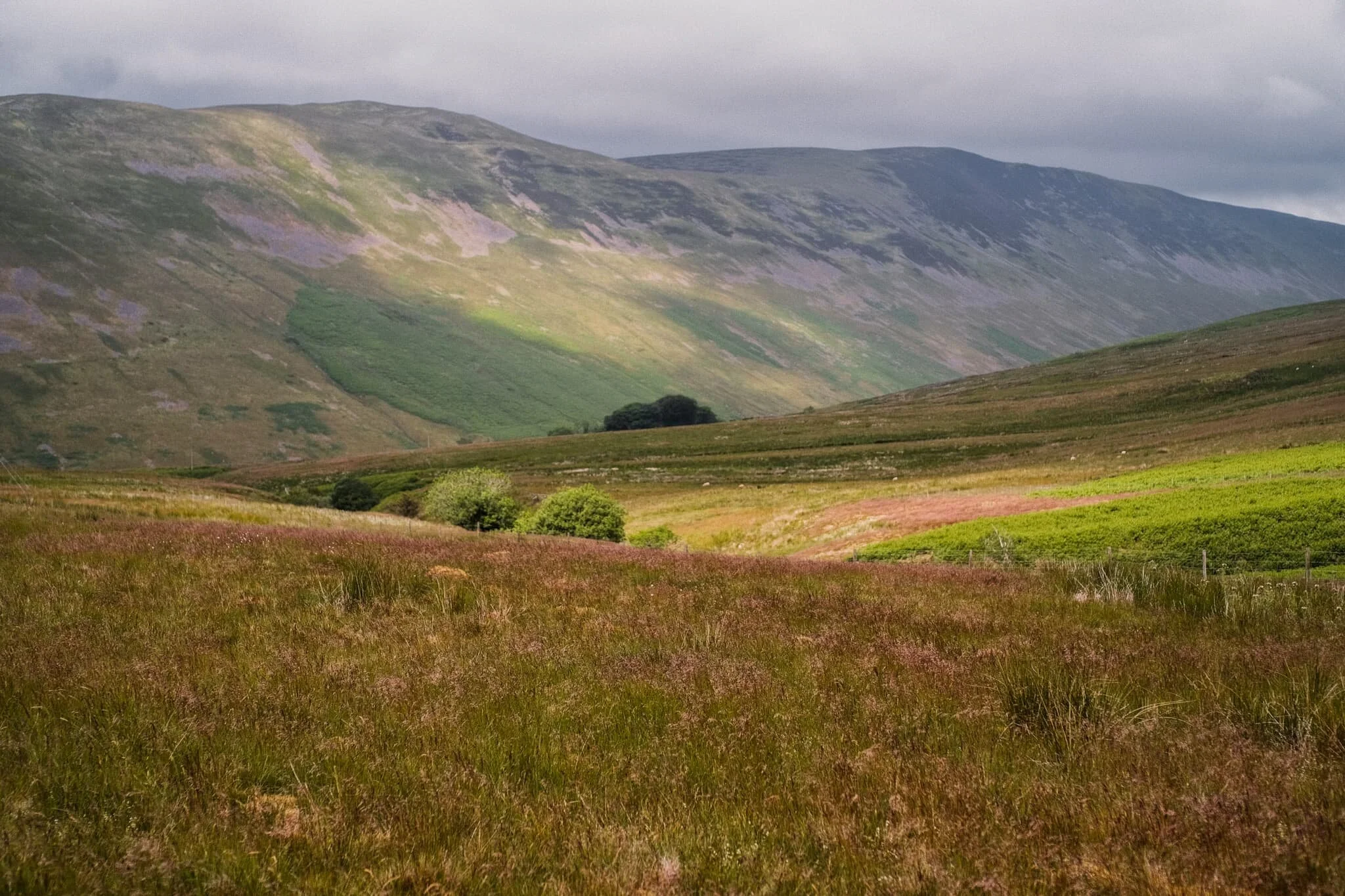 A beam of light scans across Barbondale and its highest fell, Calf Top.