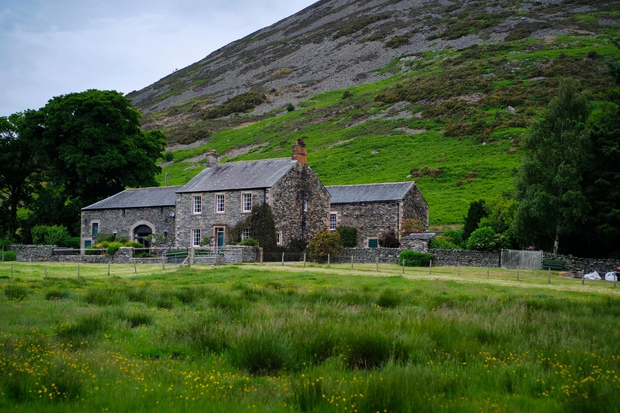 Tiny Mosedale village, nestled underneath Carrock Fell (661 m/2,169 ft).