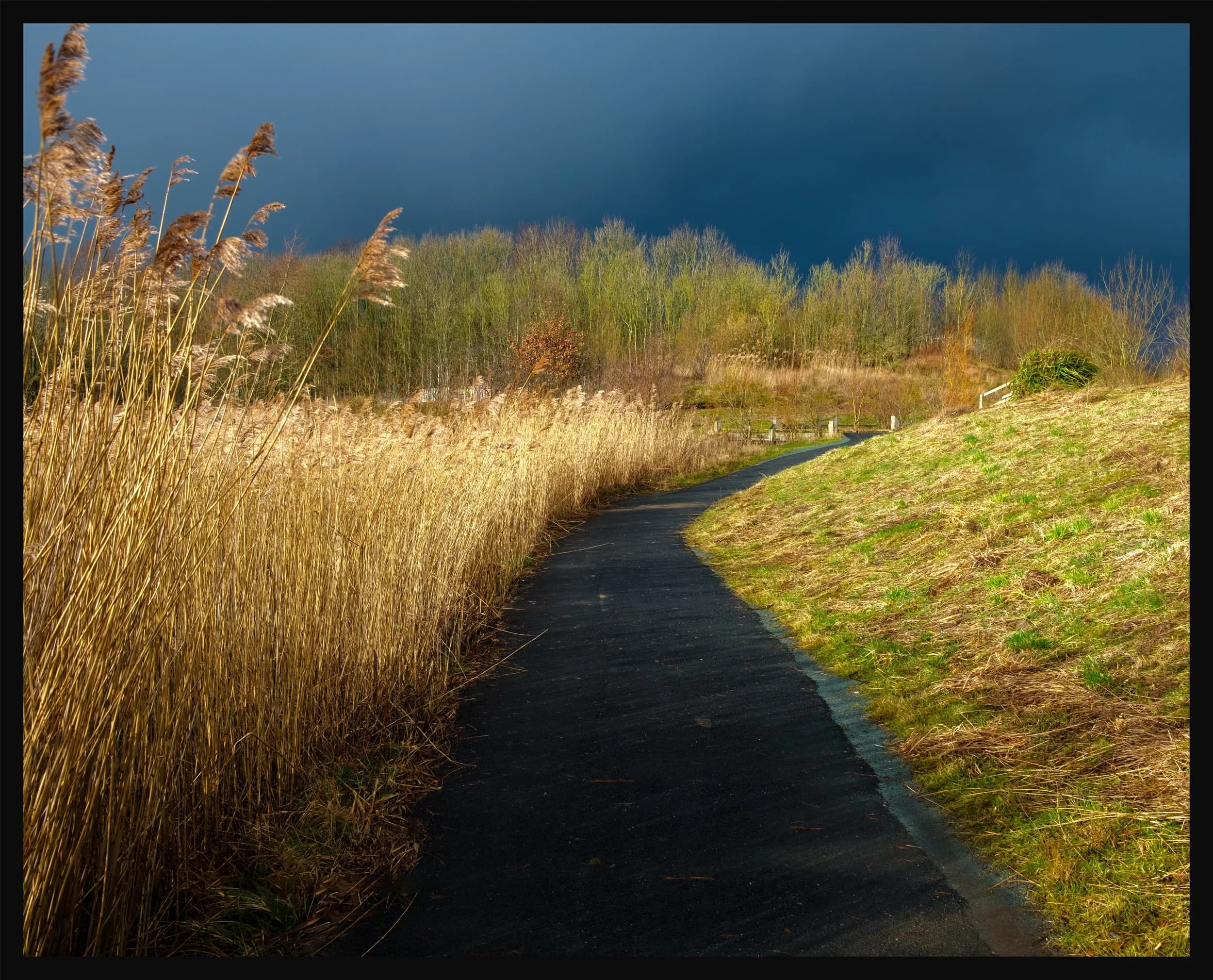  Nearing the floating visitor village the sun broke out behind us, illuminating the landscape whilst another dark squall approaches overhead. 