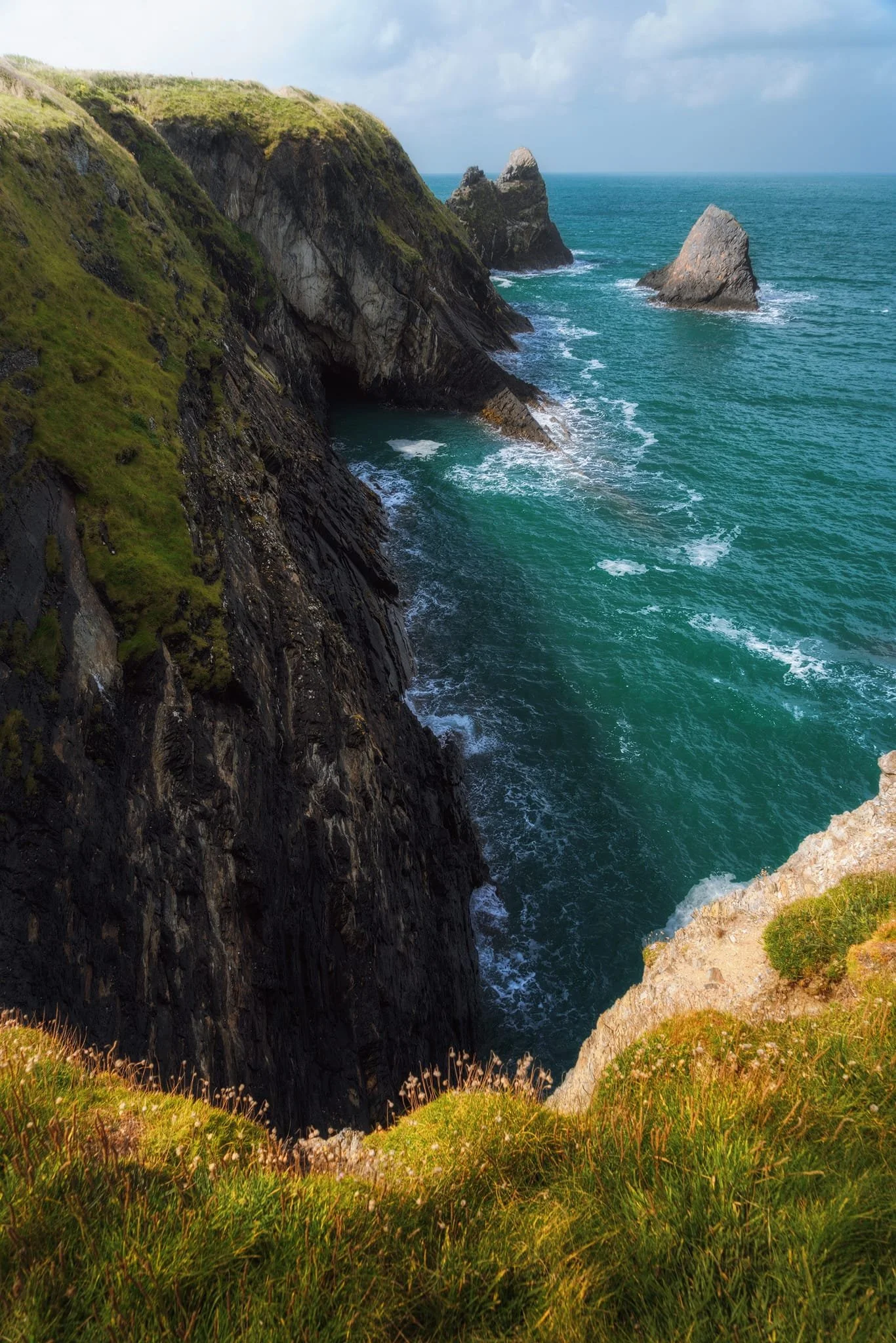  A sheer drop down to the sea at my feet, as near as I dared it, but for this vertiginous composition of  Careg Wylan . 