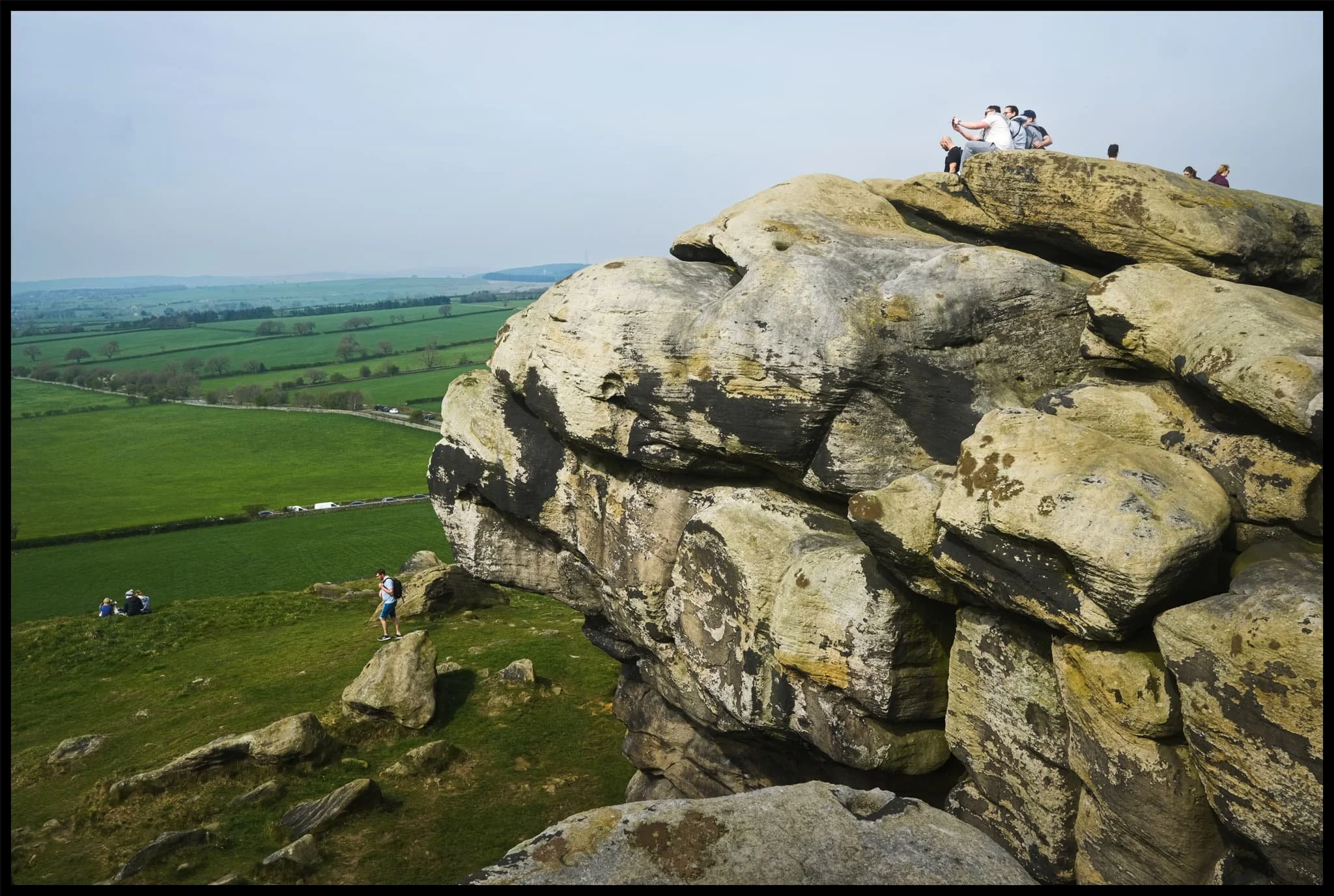  People cherishing the experience and moment in their own way from the top of Almscliffe Crag. 
