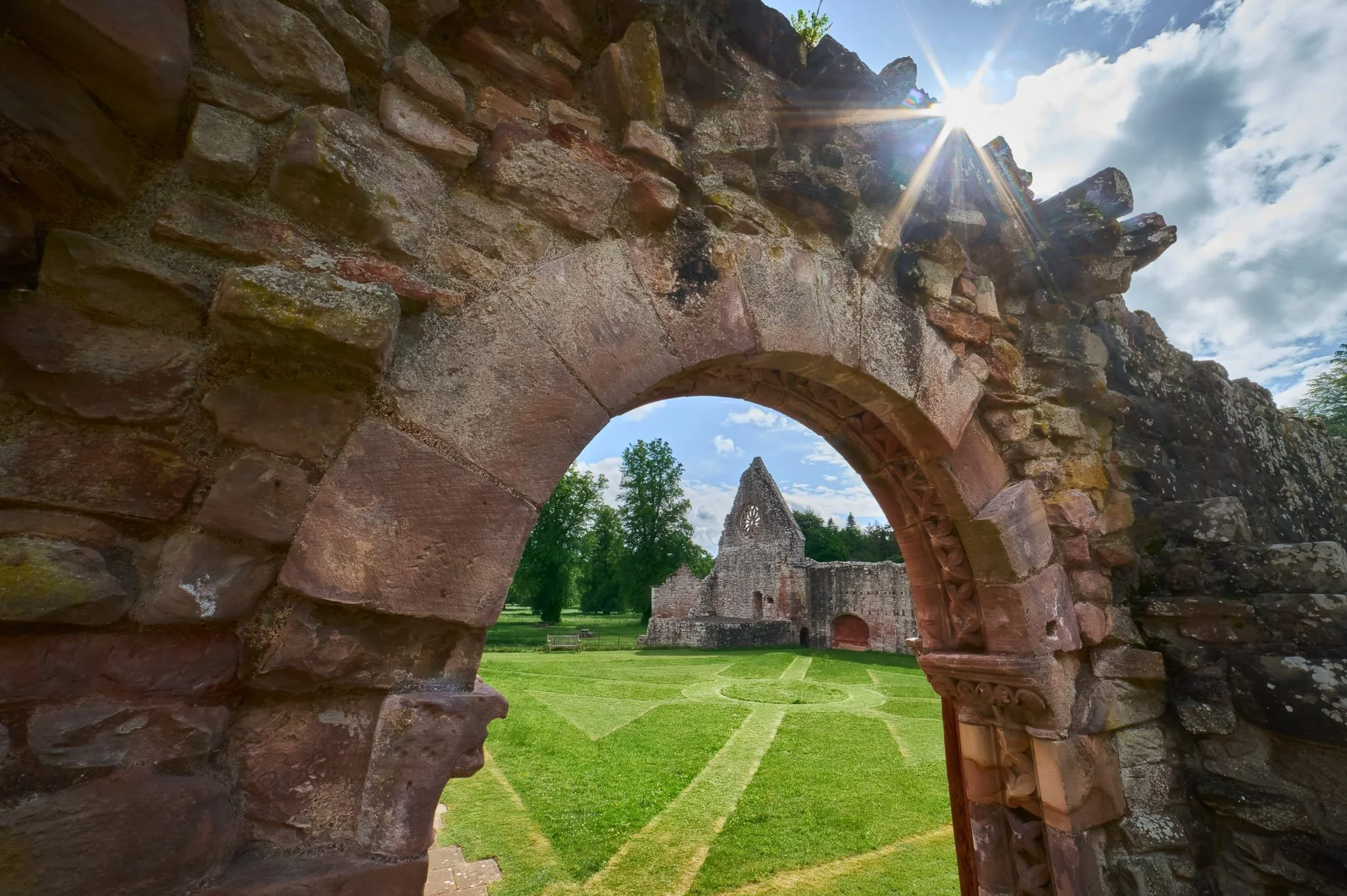  The same entrance, now looking towards the refectory with the beautifully detailing of St Catherine&rsquo;s wheel window. I enjoyed the beautiful maintained courtyard, and used its lines as a compositional aid. 