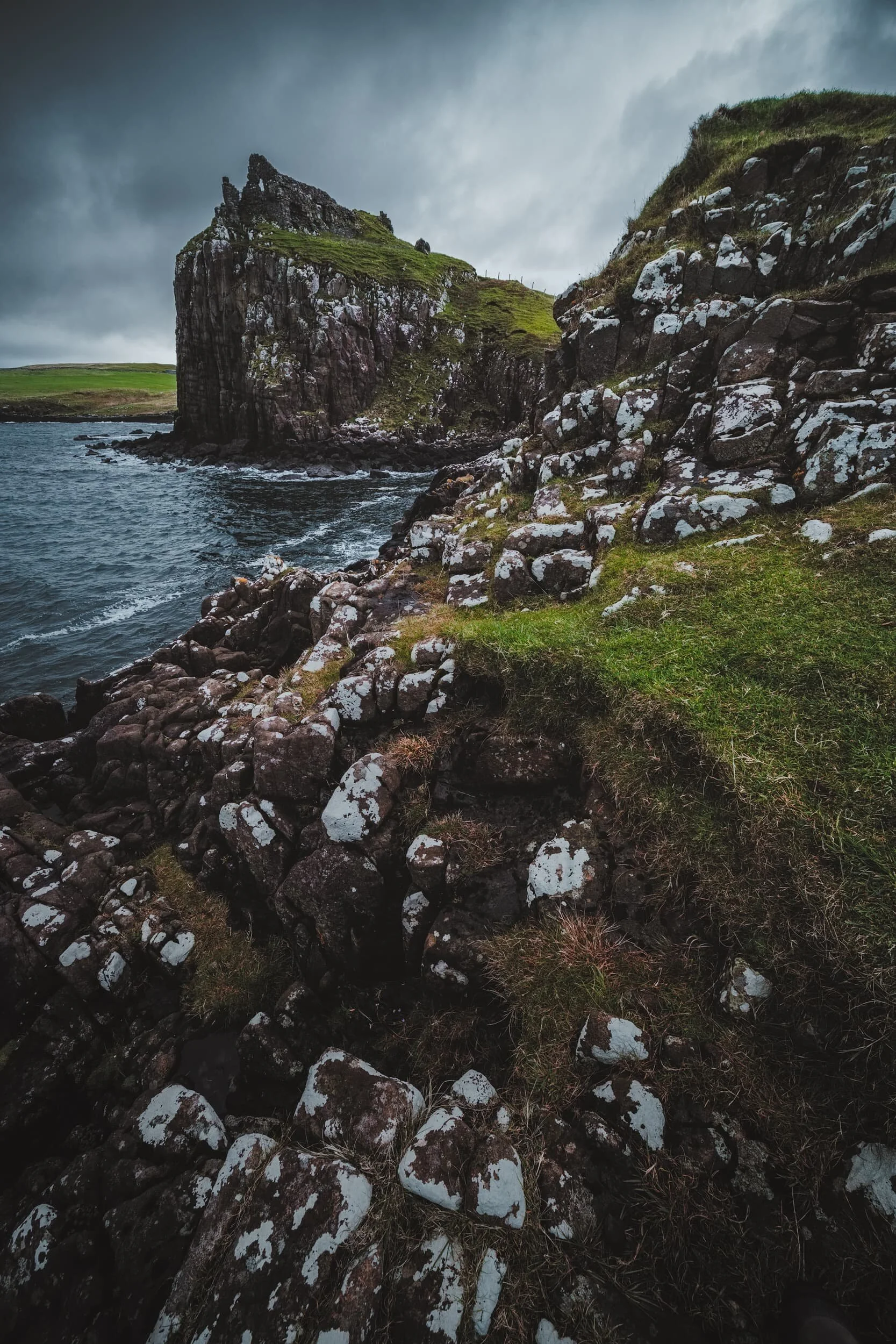 An ultra-wide angle view of the ruins of Duntulm Castle. The coast around Duntulm heavily features these stepping-stone basalt rock formations.