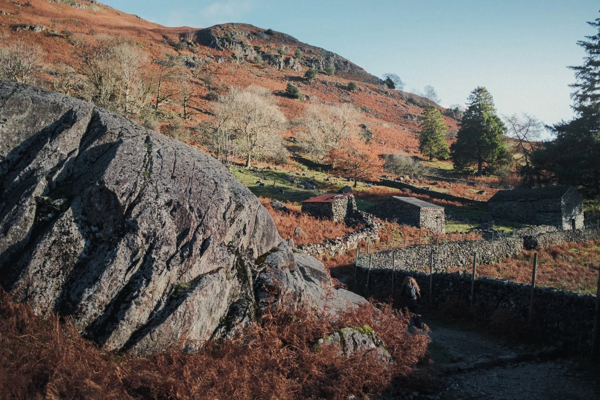  Gradually, the path increases in quality as it navigates around giant boulders and ancient barns. 