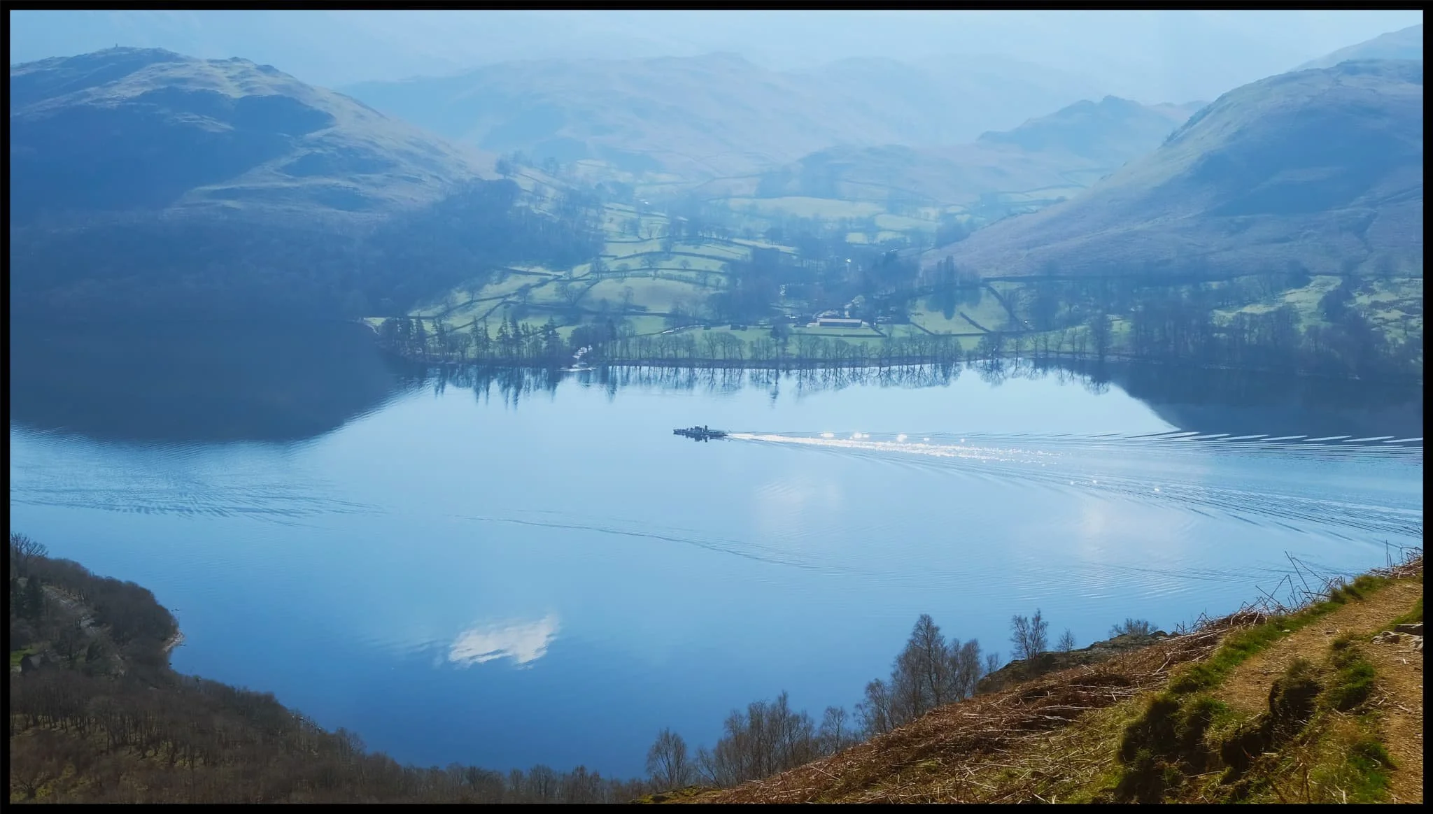  Hundreds of metres below us the  Ullswater Steamers  begin the first of many travels across the lake. 