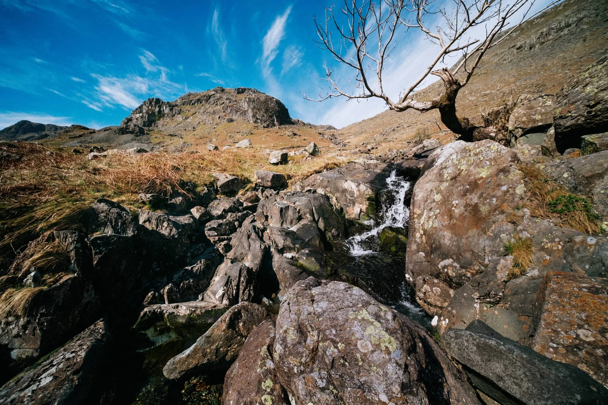  After reaching the head of Grisedale we crossed the tiny footbridge and started our way back down the north-eastern side of the valley. We stopped at Nethermostcove Beck to shoot some compositions looking towards Eagle Crag, as well as for refreshment. 