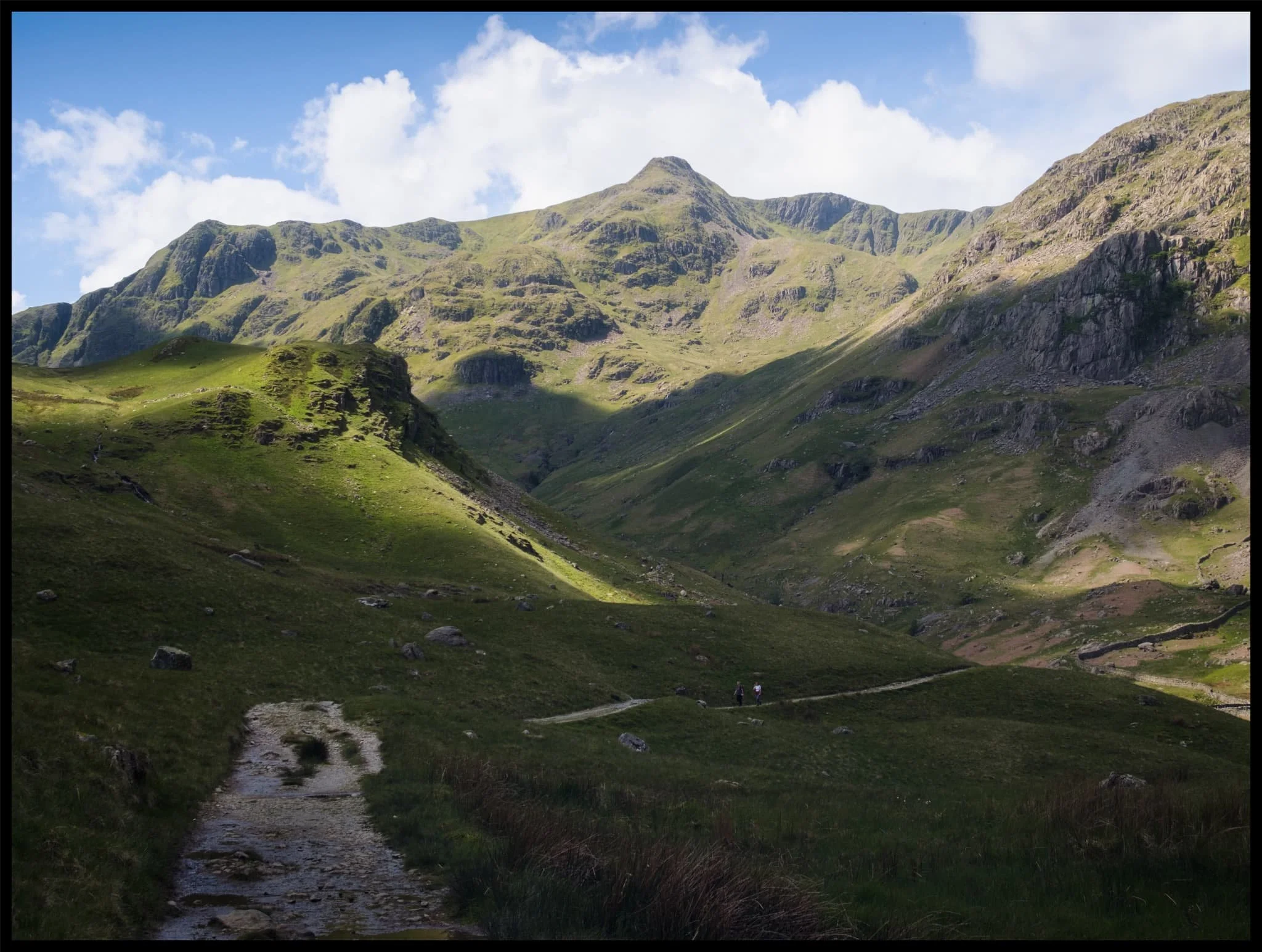  The small crag of Post, on the near left, enjoys a slither of summer light scanning along its surface. In the distant left are Falcon Crag and Tarn Crag, dead centre is Dollywaggon Pike, and to the right is Eagle Crag, a sub-peak of Nethermost Pike. 