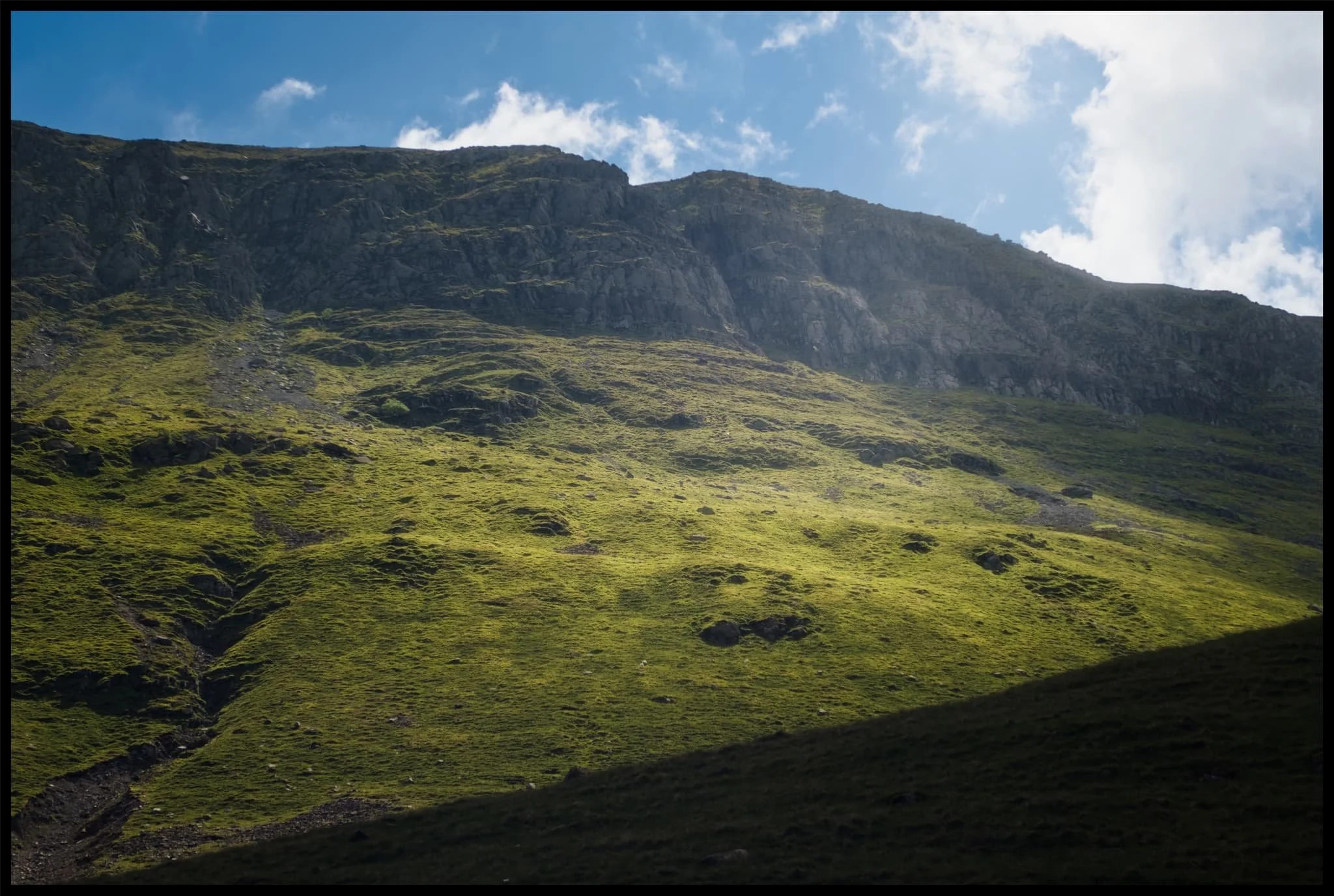  Immediately above us, on the southern side of the valley, is the sheer wall of St. Sunday Crag. 