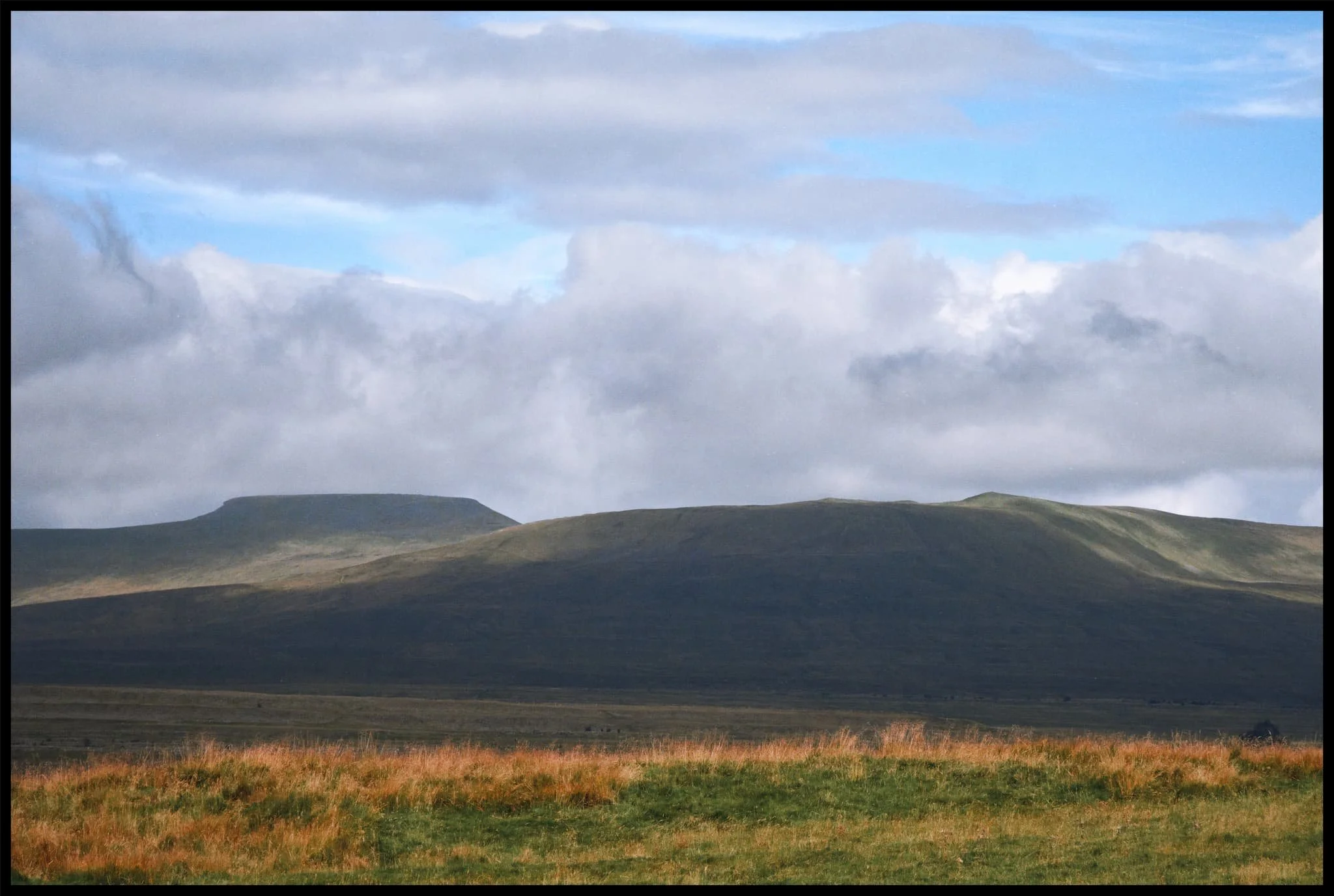  As the morning progresses the clouds burn off, revealing the flat-topped Ingleborough on the left with Simon Fell on the right. 