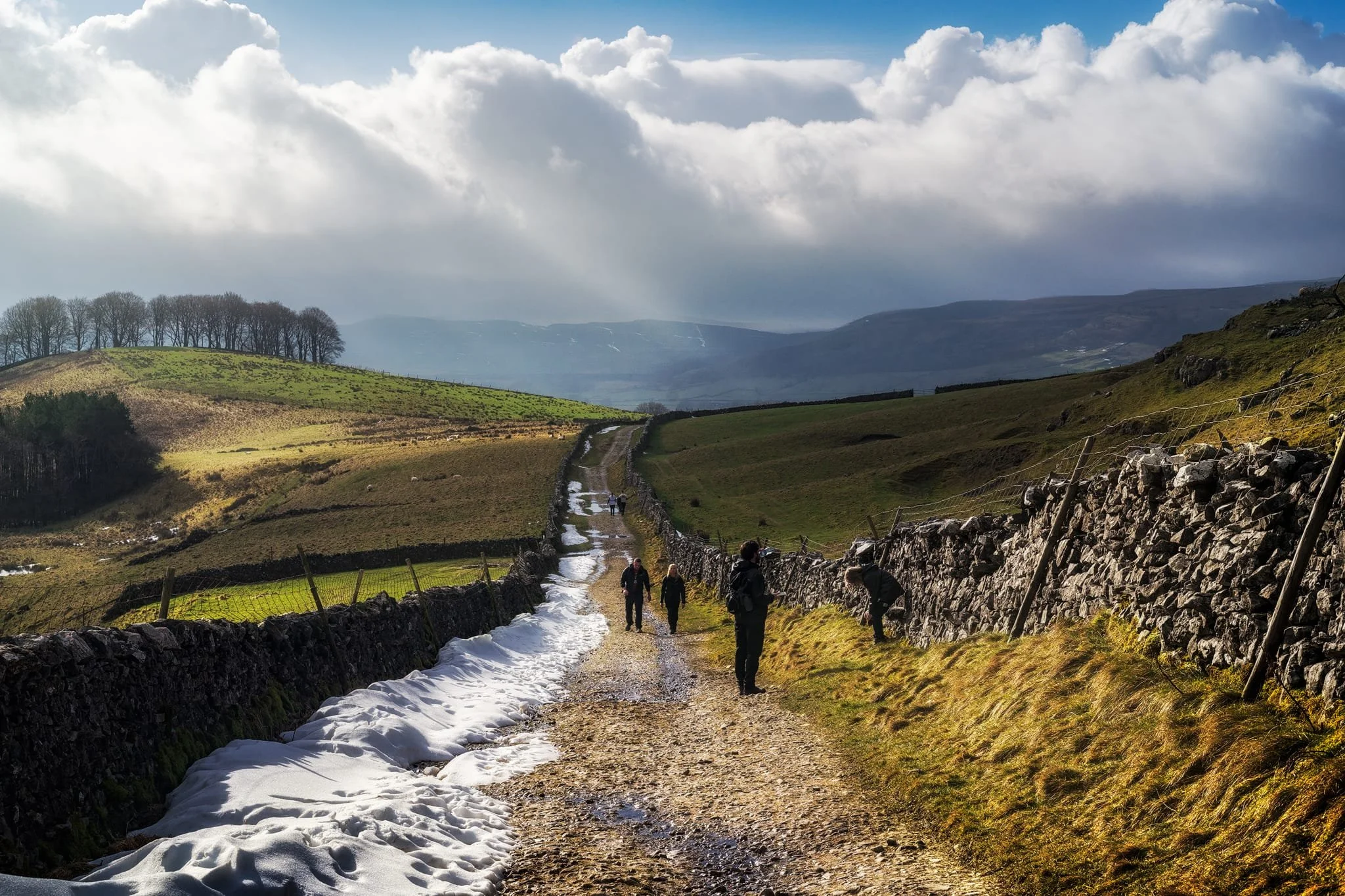 Looking back at where we came from. We were very much on the edge of two weather systems. Conditions over Horton-in-Ribblesdale saw blue skies and puffy clouds, but closer to Pen-y-Ghent it was blowy, dark, and stormy, giving us epic light.
