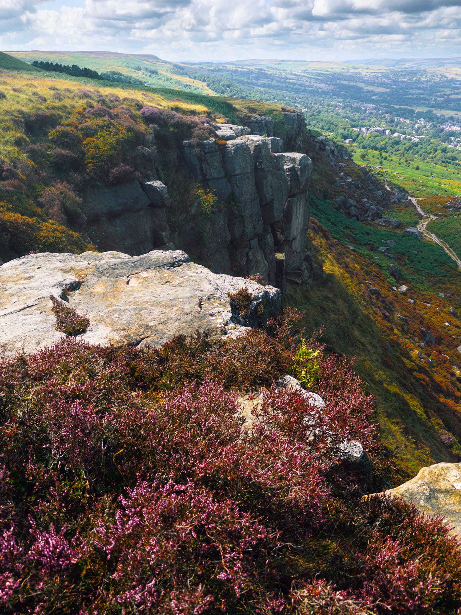 A burst of sunlight from betwixt the clouds illuminated the scene as I picked my way across Ilkley Crags, daring to get as close to the edge as possible for some vertiginous compositions.