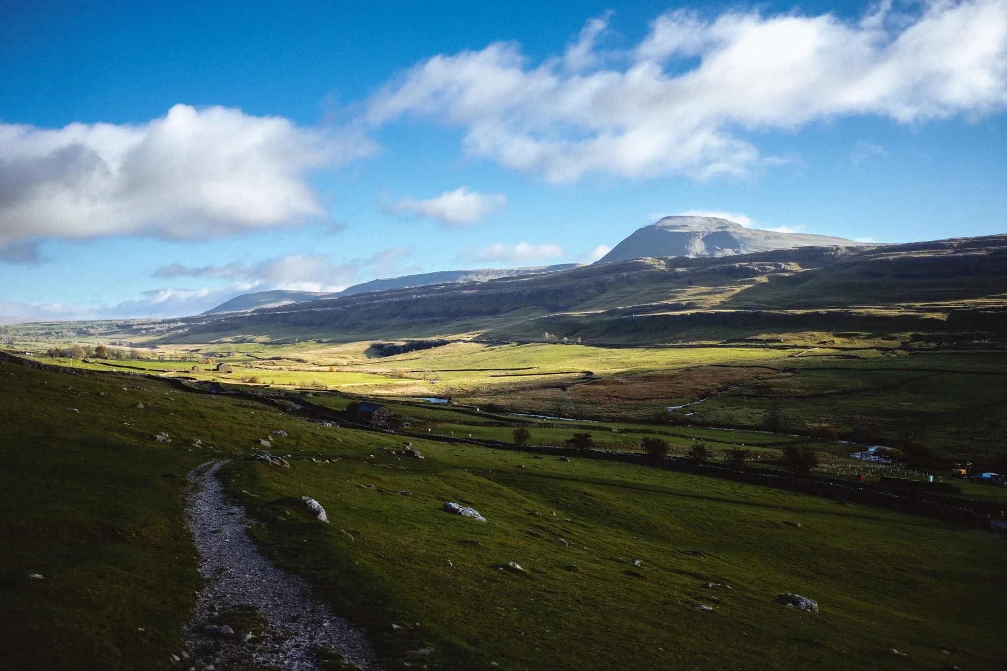  Twistleton Bridleway descends down into the next valley, where you&rsquo;re greeted with this magnificent view of one of the Yorkshire Dales&rsquo; most famous peaks: Ingleborough (723 m/2,372 ft). 