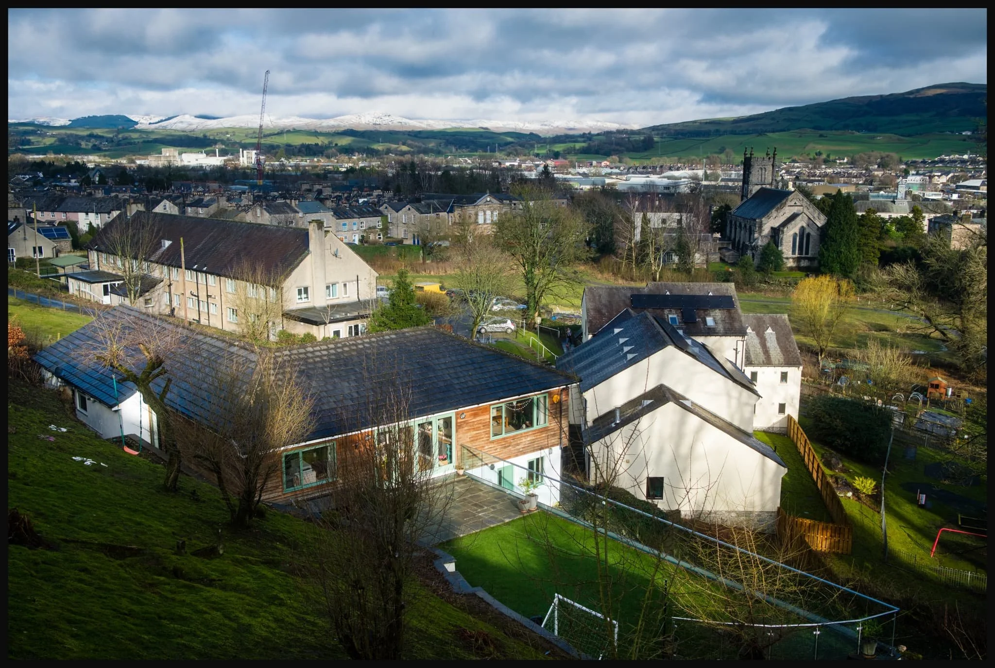  From Low Fellside the view spreads out more. The Whinfell fells and the Howgills are covered in a fresh coating of snow. 