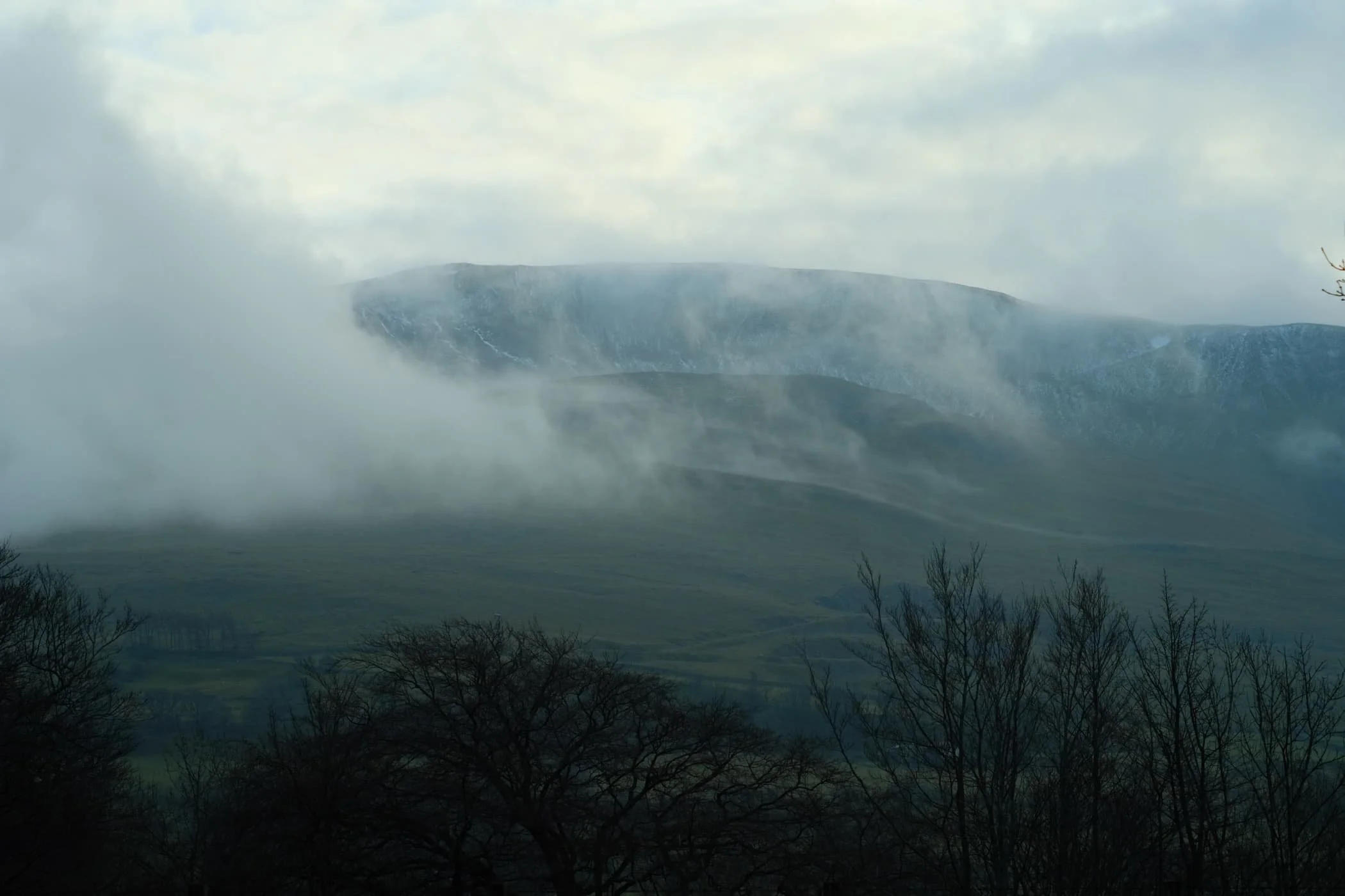  The end of the trail. Beyond the A66, Clough Head provides a dramatic backdrop as it tussles with the clearing fog and mist. 