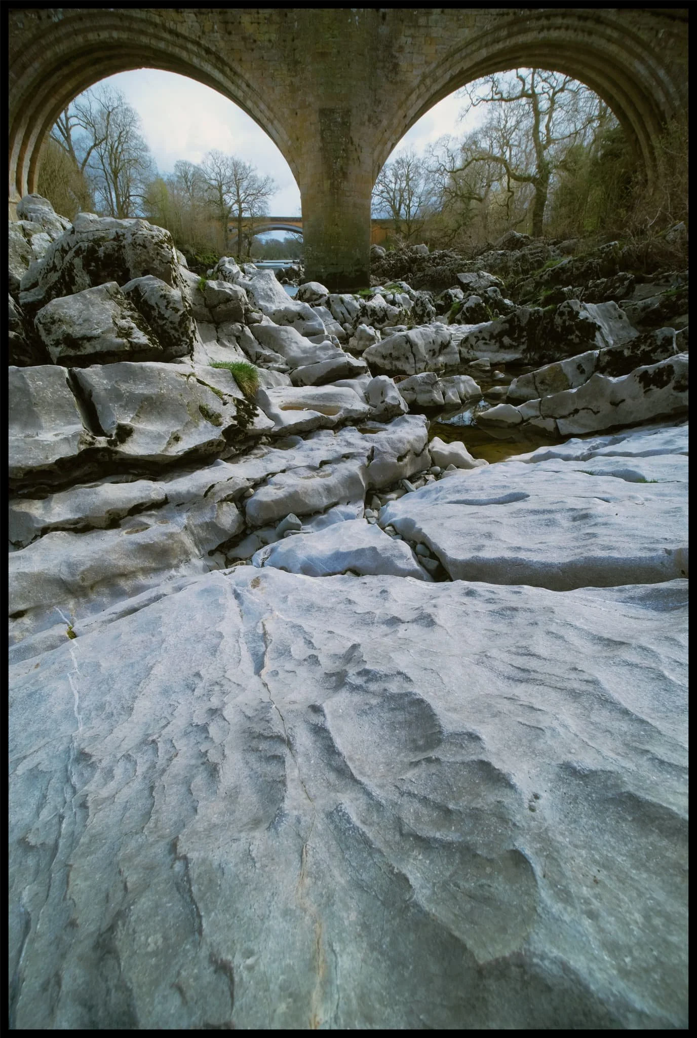 From the bottom of Mill Brow I followed the River Lune all the way to Devil&rsquo;s Bridge. Here, limestone formations are abundant and I had fun arranging compositions involving these rocks and the formidable Devil&rsquo;s Bridge. 