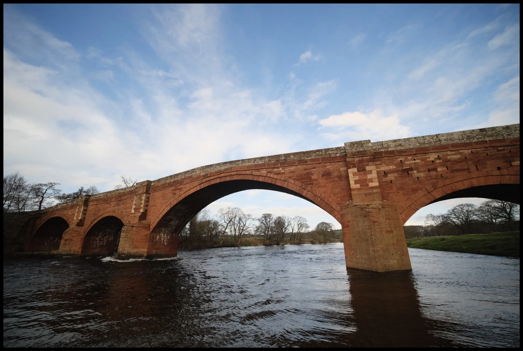  I whipped on my 9mm ultra wide lens to capture the whole span of the bridge as well as the lovely cloud textures that were forming. 