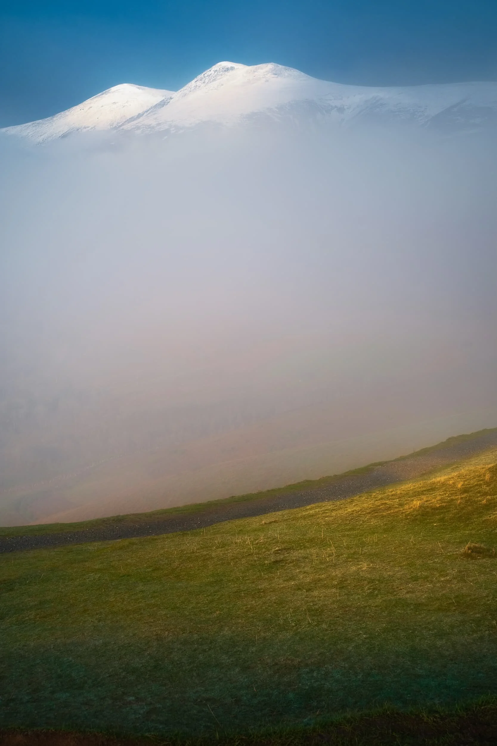 As we broke off the Cumbria Way to take the path up towards the Latrigg summit, and patch of mist floated our way and obscured views back towards Skiddaw (931 m/3,054 ft). I quickly nabbed this 35mm composition of what turned out to be a fleeting moment.