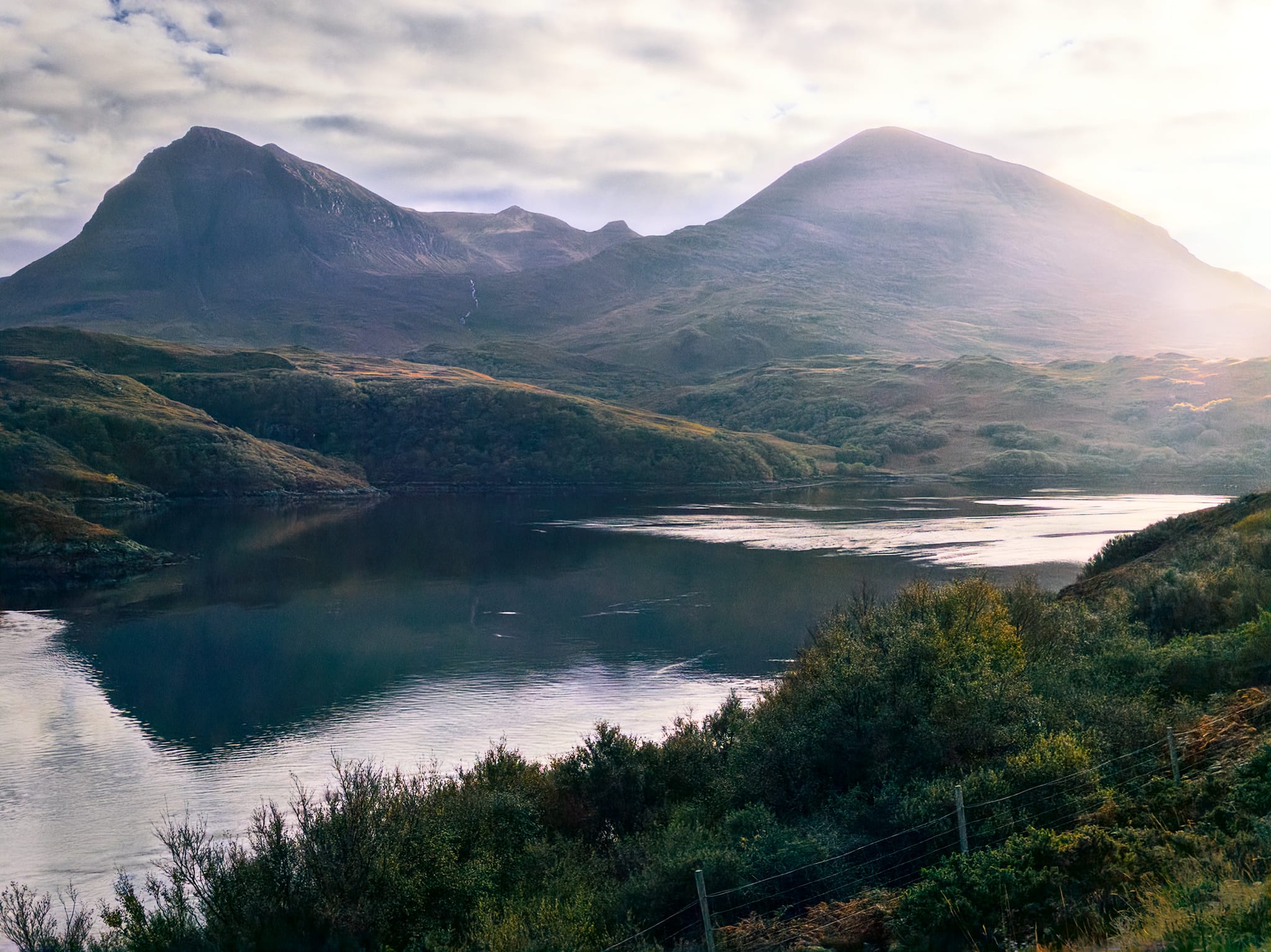 The final shot of the day before embarking back to Ullapool. Two of Quinag’s peaks, Sàil Gharbh and Sàil Ghorm, partially reflected in the loch as the sun began its descent.