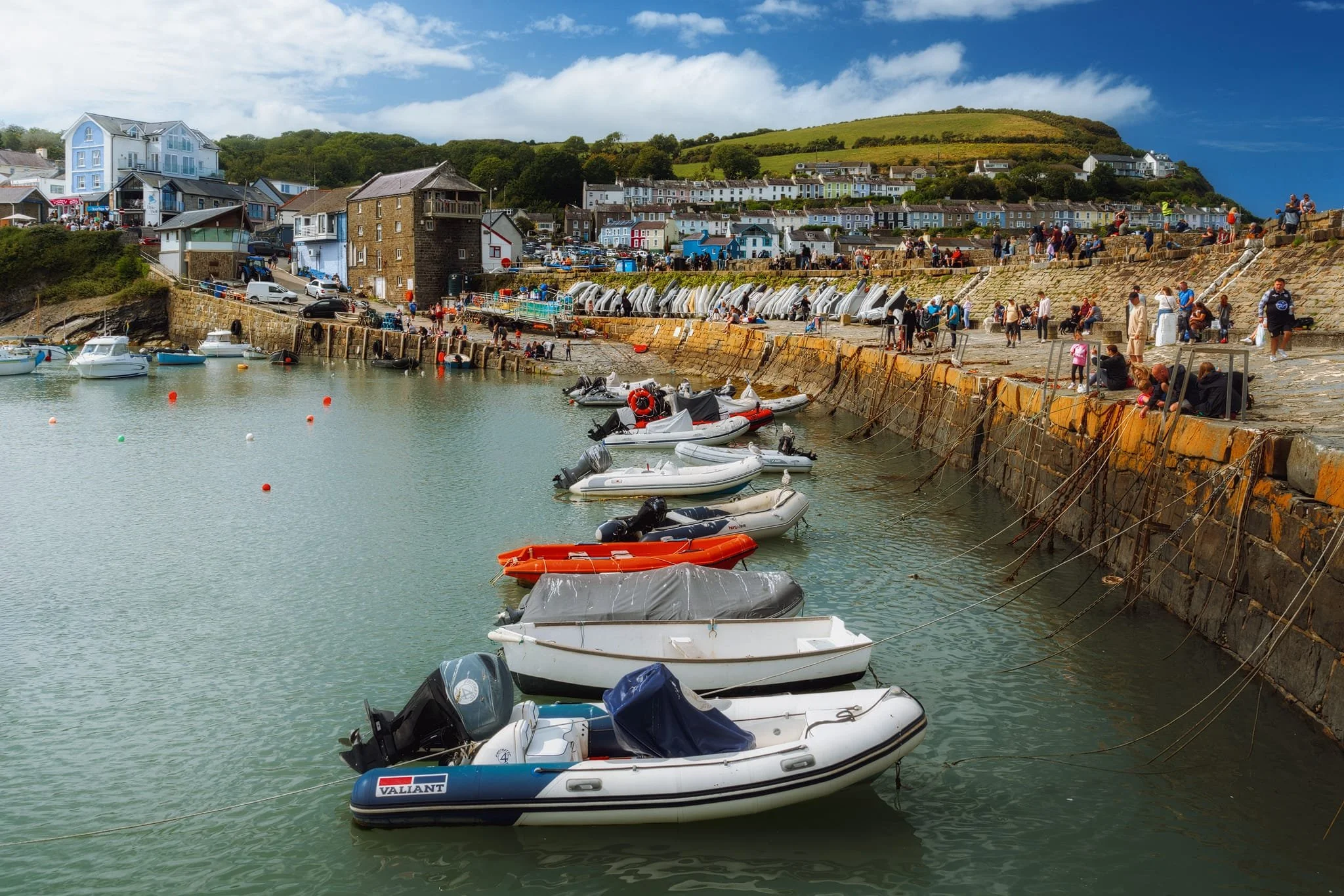Lisabet and I paid for a small boat trip around the waters of Cardigan Bay from New Quay, courtesy of SeaMôr Dolphin Watching . While we were waiting at the old stone pier, I captured this scene of New Quay in its full summery touristy glory.