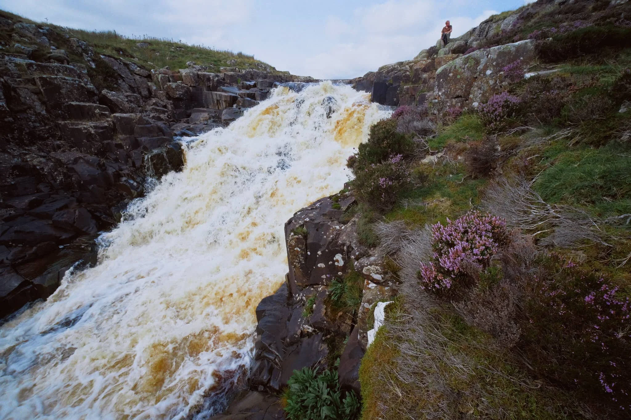 But doing so enables you to get right next to the falls for cracking views like this. A man perched at the top of the falls helps provide a sense of scale.