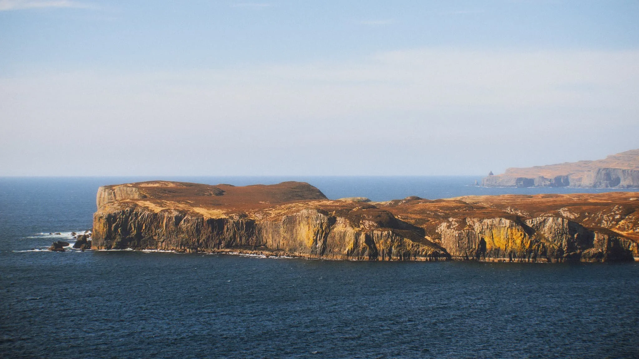 Once on the island it’s simple enough to navigate your way towards the highest cliffs. Once there, you get stunning views like this . Zoomed in, the island of Wiay is clear and you can even make out the cliffs and sea stacks of MacLeod’s Maidens.