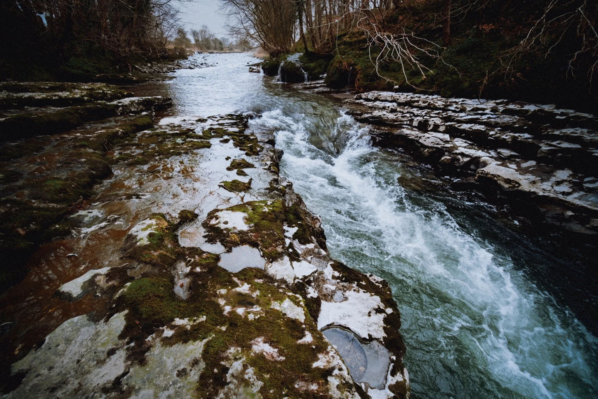 The point where the River Kent is forced through a narrow limestone passage, gouging out a mini-gorge in the process. The water was super clear.