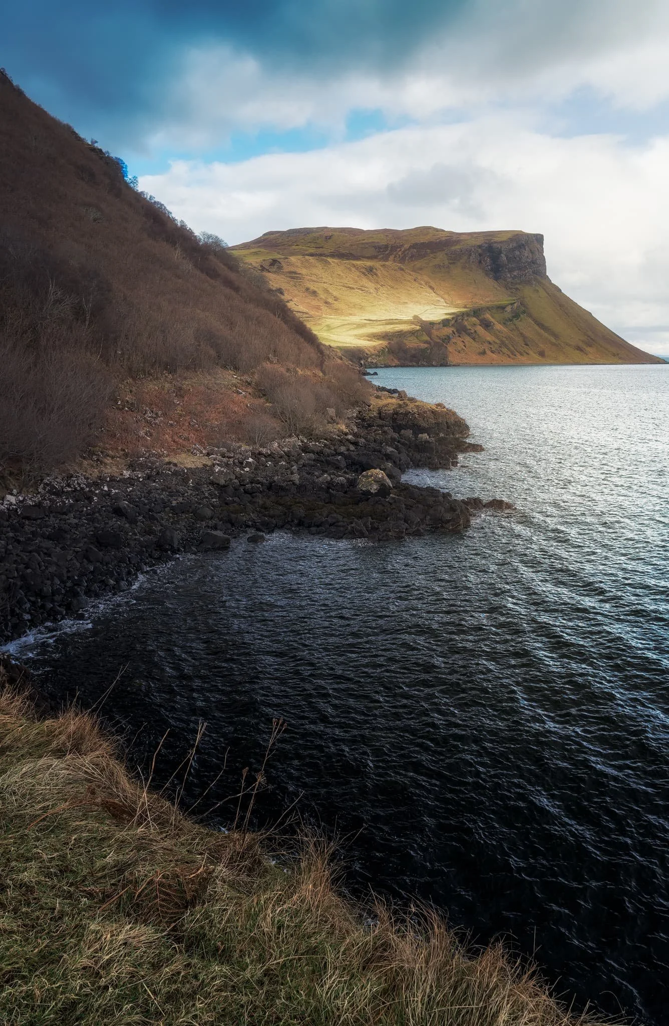 As we rounded the corner at Sgeir Mhòr, this magnificent view down the coastline to the illuminated cliffs of Sìthean a’ Bhealaich Chumhaing appeared.
