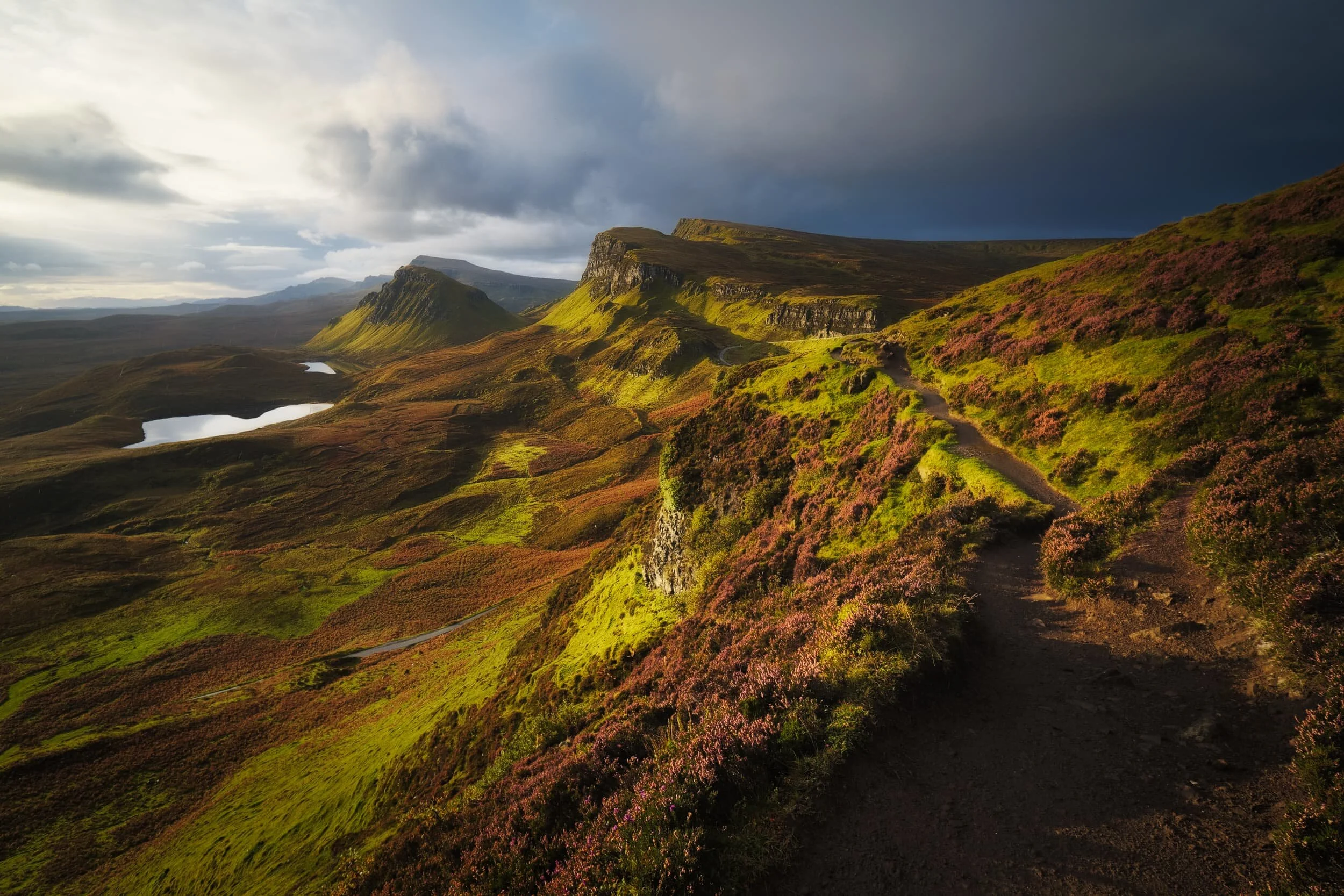  When I turned back for a composition of the route we had taken, I saw this storm moving in behind the Quiraing… so we decided to turn back and head towards the car. 5 minutes after shooting this photo we promptly got  soaked . 