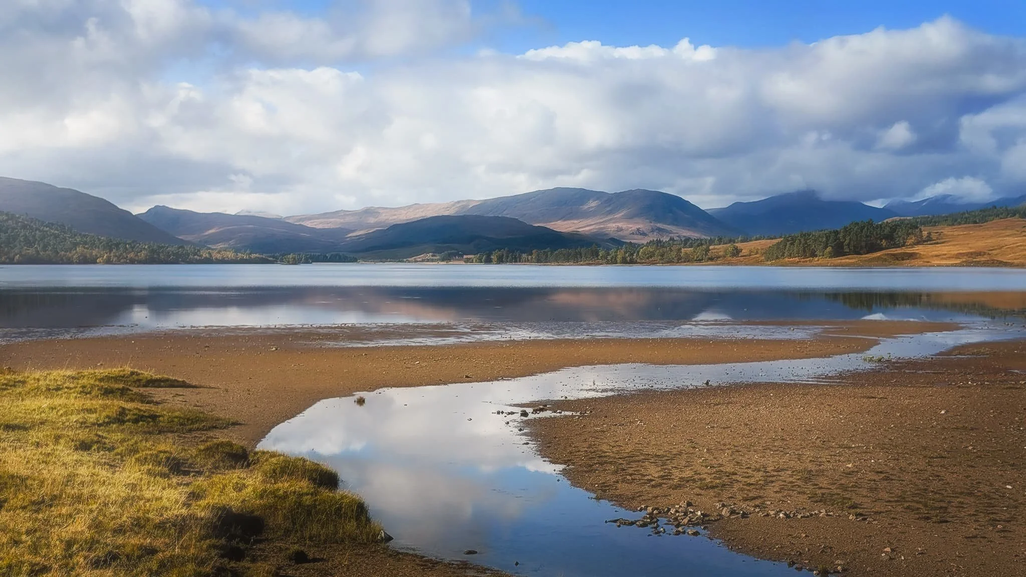 It turns out that getting to the loch shore of Loch Tulla is difficult. The road runs right alongside its north-eastern point, and is raised above the loch. You can’t clamber down the verge towards the shore because of barbed fencing. So, this shot from the roadside of Tulla and towards the Black Mount range was as best as I could manage.