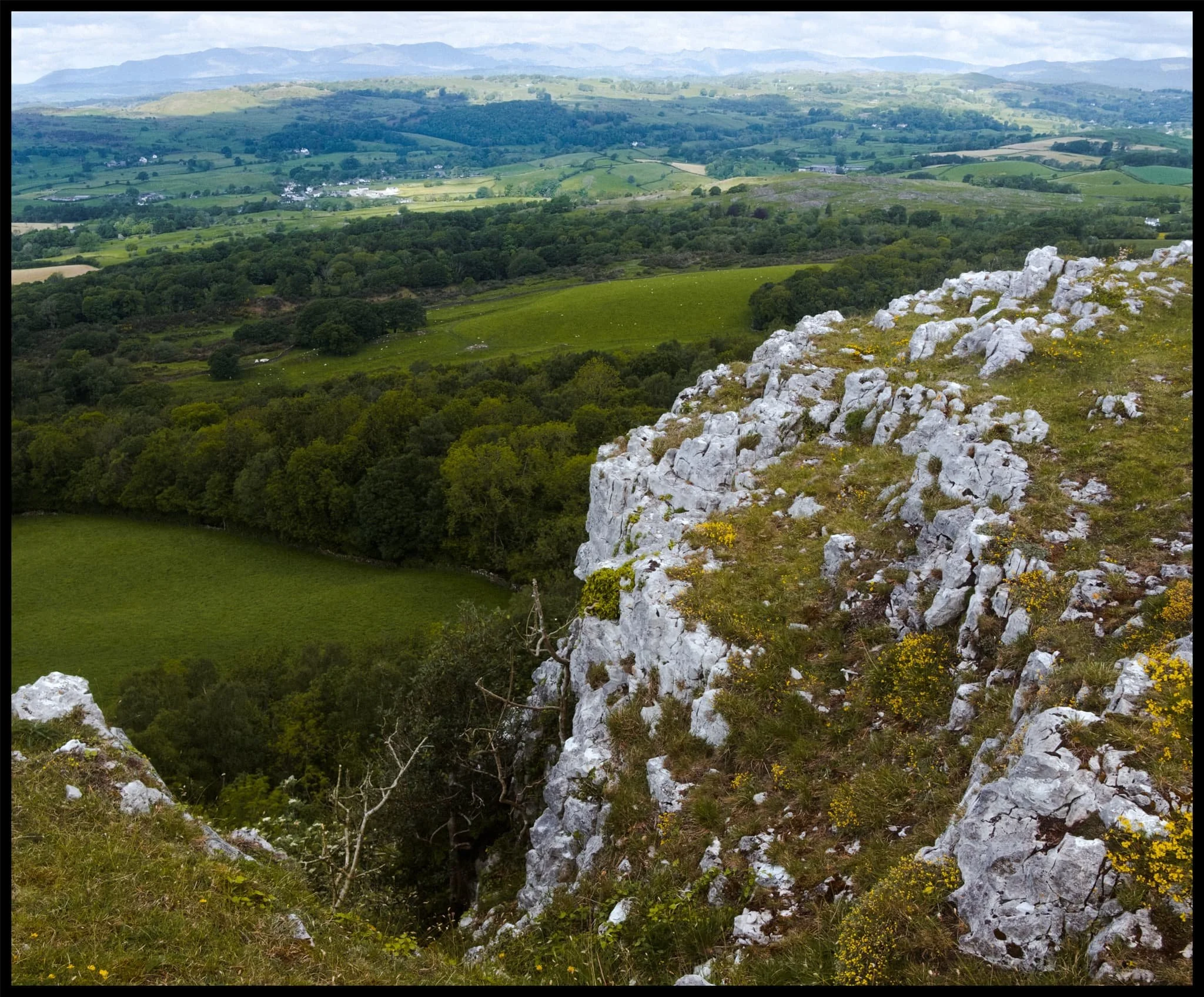  A 3-shot vertorama featuring the nick and drop of Hodgson&rsquo;s Leap with the Lyth Valley and the Lakeland fells beyond. 
