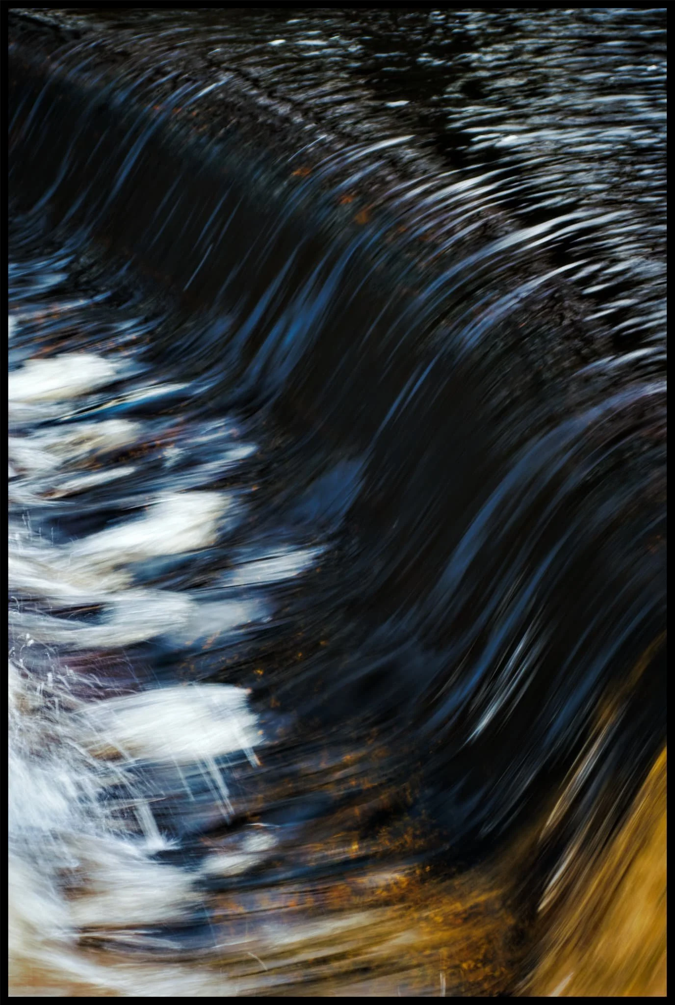  After all the rain we&rsquo;ve had, the River Rawthey was absolutely gushing with water. At the weir near New Bridge, the curves of the weir and the water caught my eye and I lined up a composition. Turned out quite nice! 