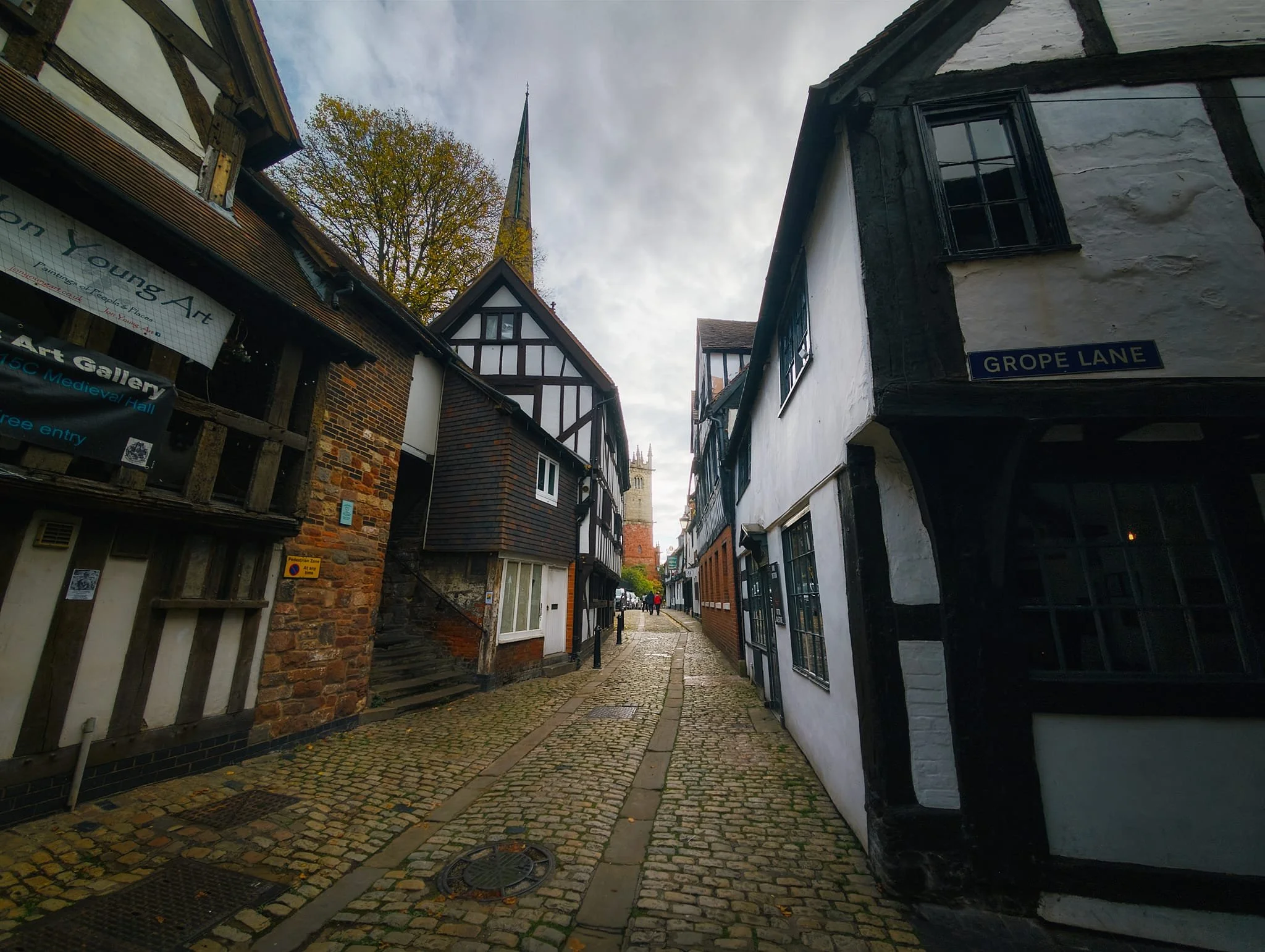  There are two theories for the origins of all the Grope or Gropecunt Lanes, one polite and one not. The polite version, certainly for Shrewsbury&rsquo;s Grope Lane, is that the name was given because of the lane&rsquo;s narrowness, which forced people to 