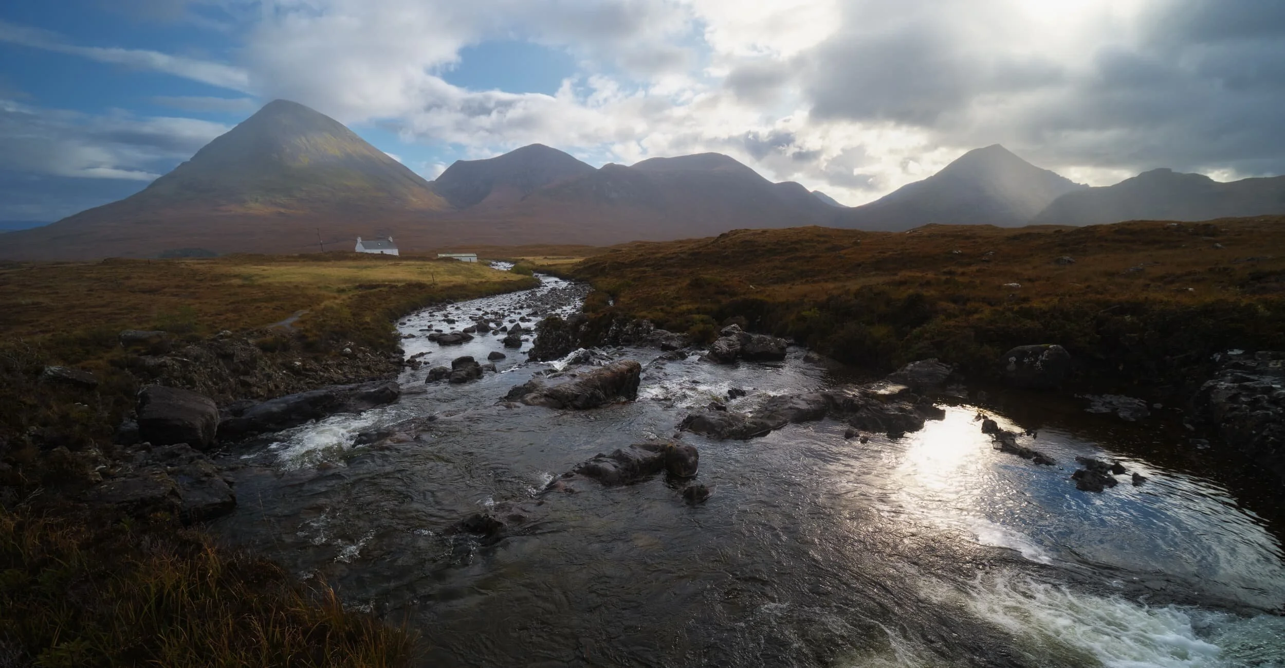  Above the cascades I nabbed this panoramic view of the Red Cuillins. The sun was very much fighting with the clouds that day, and we were alternately bathed in light then showered on as various weather systems blew across the Cuillins. 