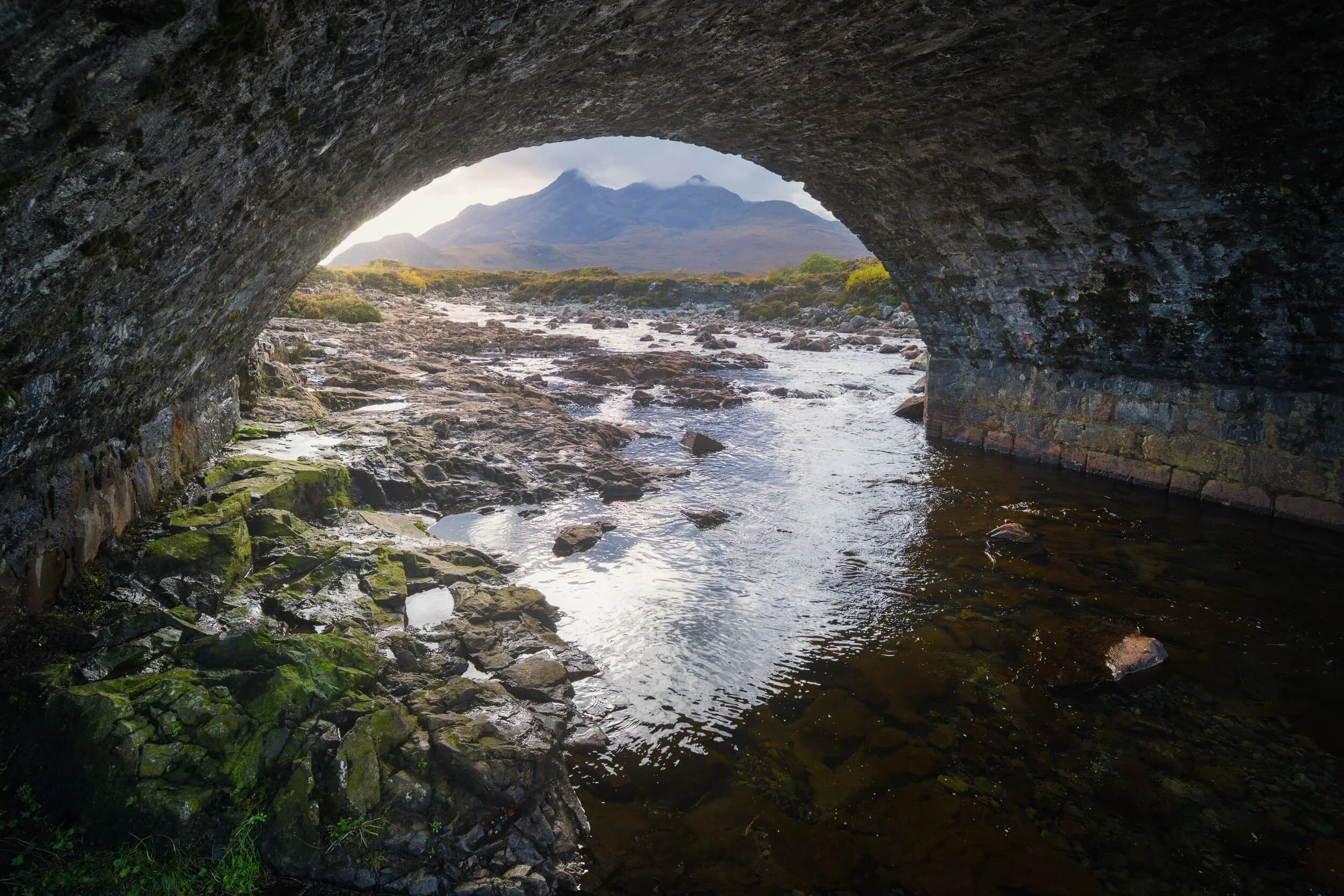  If the river&rsquo;s particularly low it&rsquo;s possible to clamber underneath the arches of the Old Sligachan Bridge. This can lead to interesting compositions involving the Black Cuillins. 