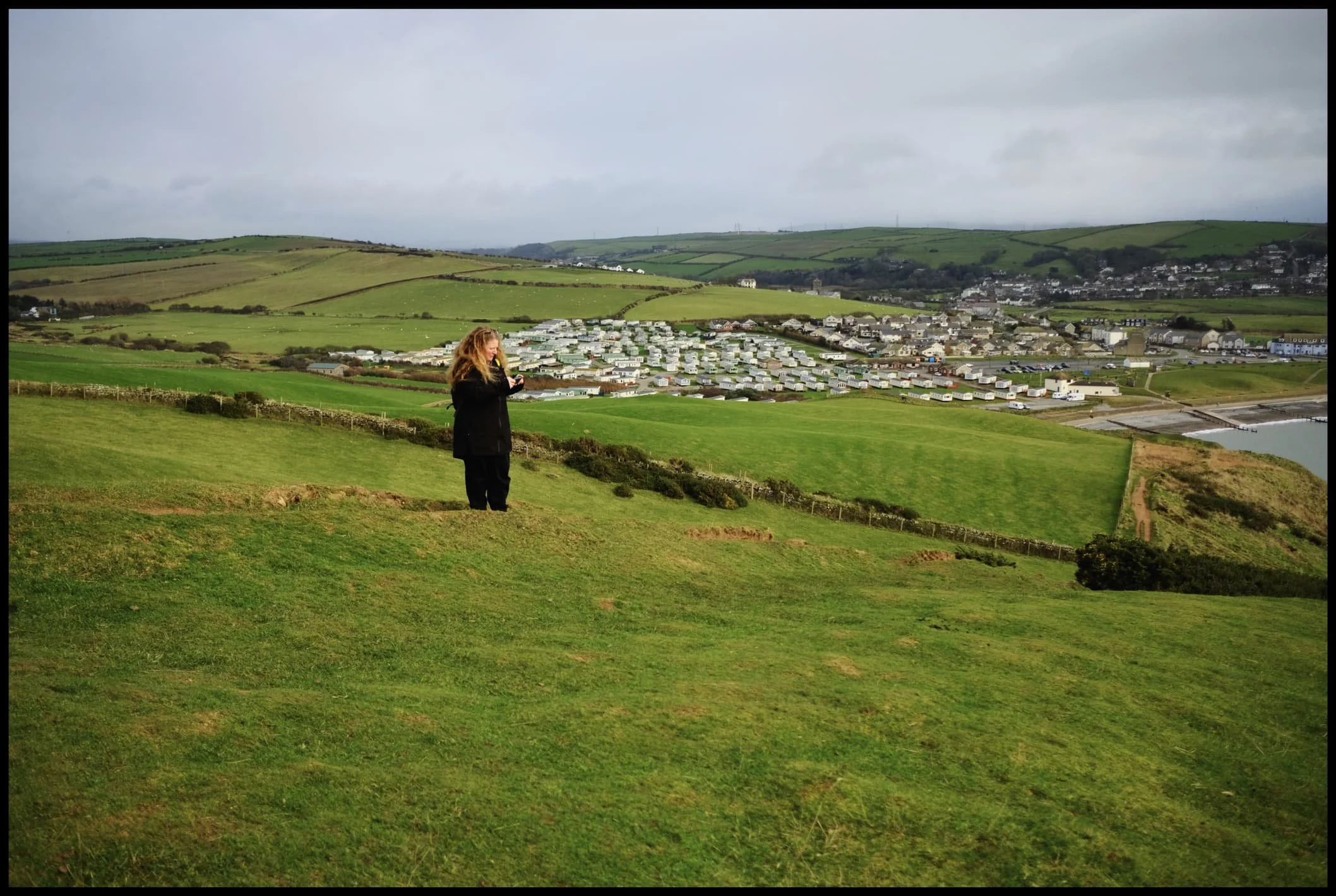  Thankfully it&rsquo;s not long before the cliff path levels out, and gorgeous panoramas to St. Bees village and the Lakeland fells open up. 