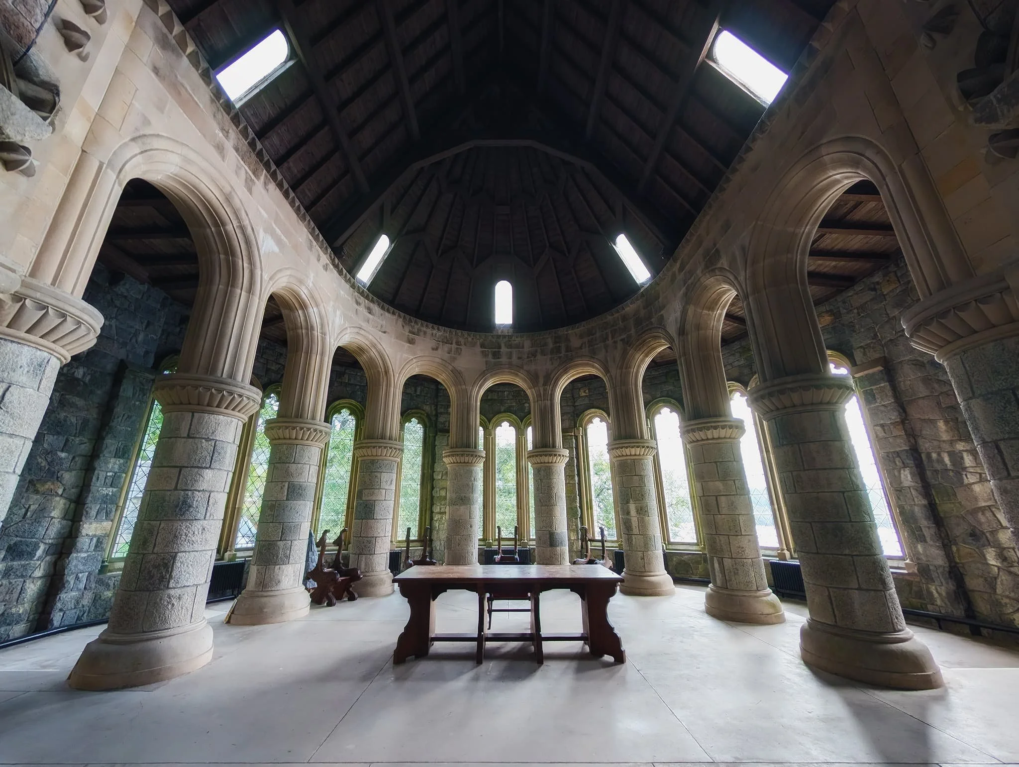  This is the Chancel. Intricately carved Spanish chestnut stalls stand as a testament to history. These ornate fixtures display the complete heraldic symbols—including coats-of-arms, crests, and badges—of the local chieftains who once ruled over nearby lands in bygone eras. 