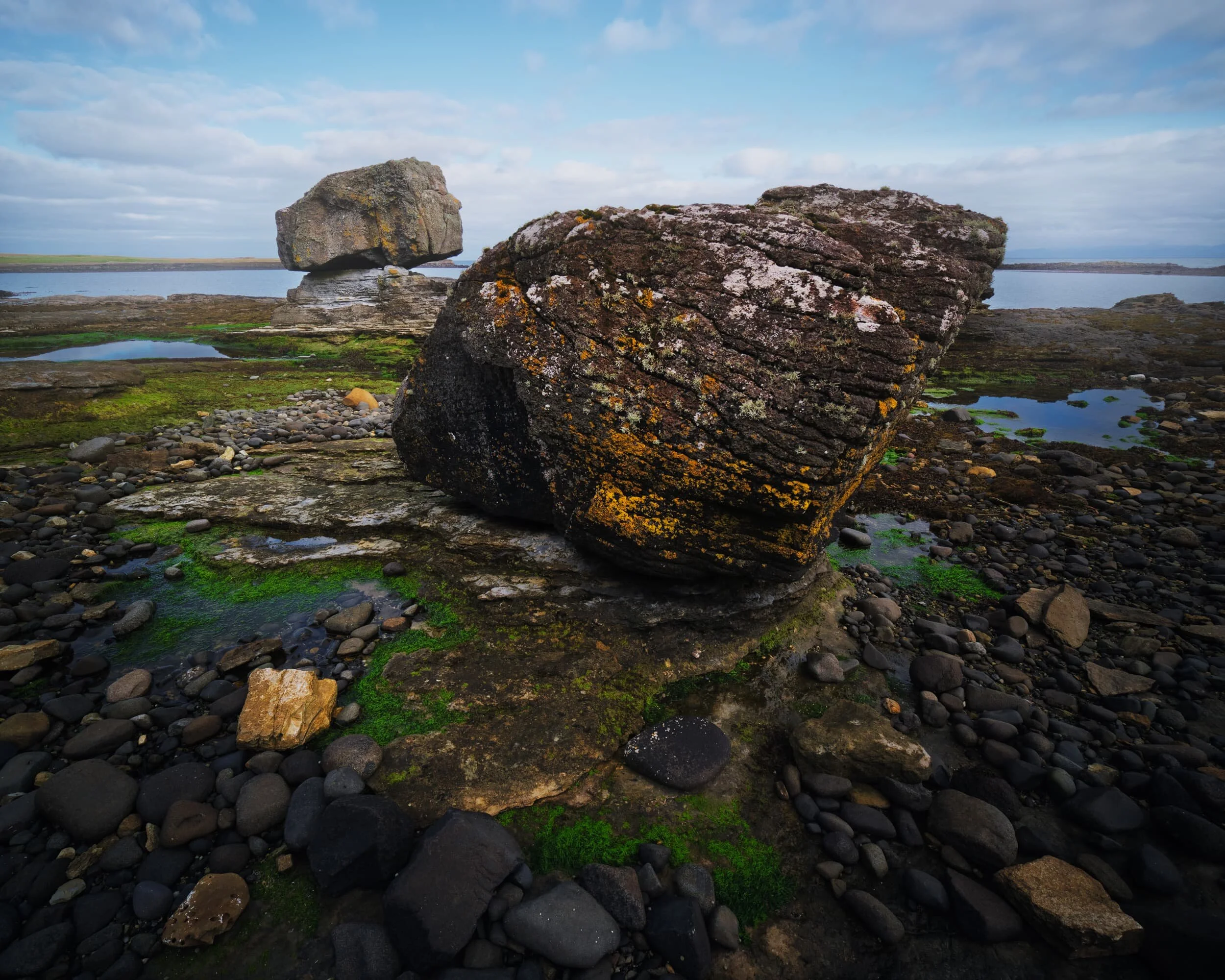 Two separate glacial erratics, which two me almost look like they are in “conversation” with each other.