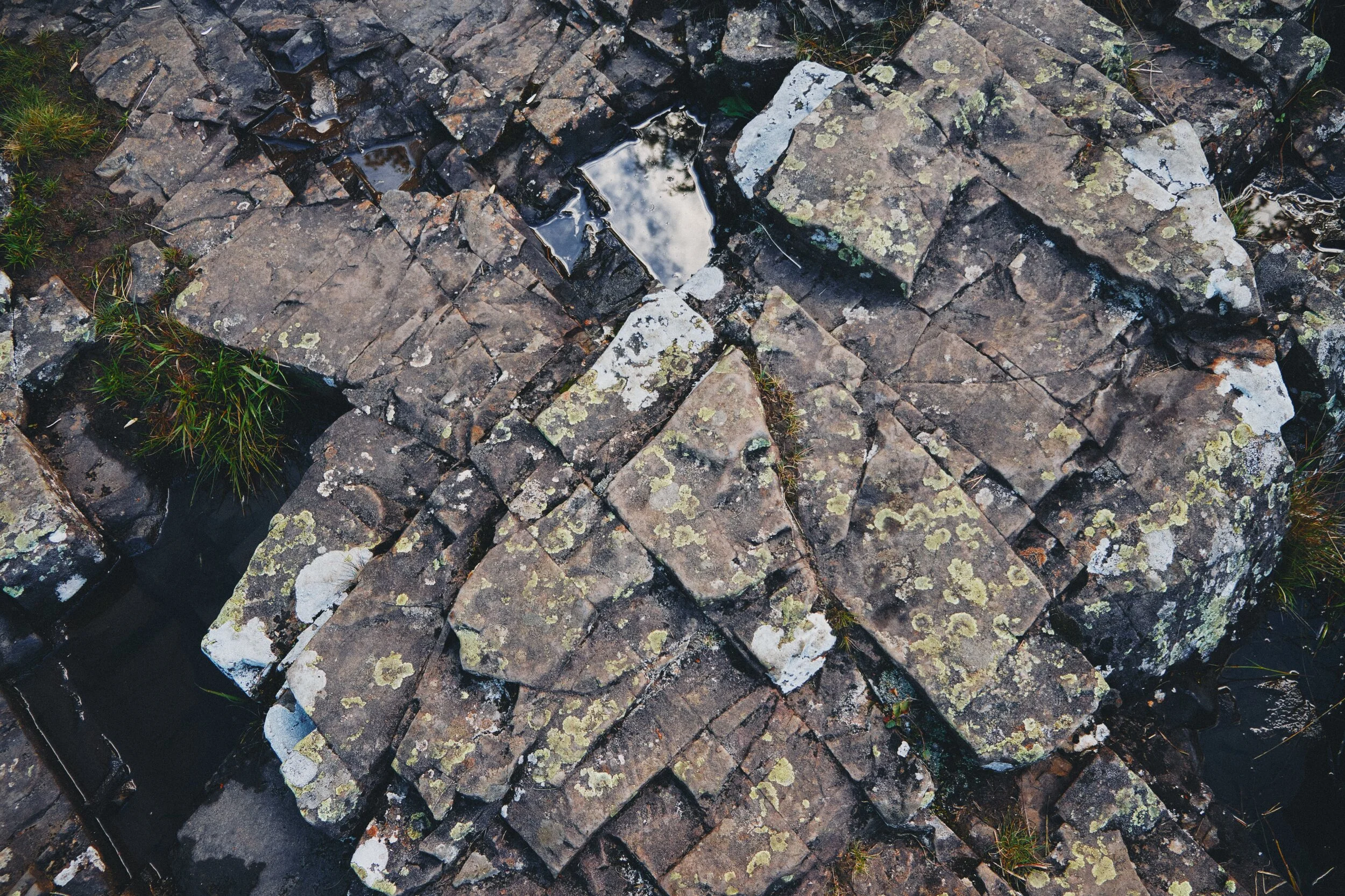 The rock here is Whin Sill, the exact same rock found at the head of High Cup Nick (you can read about our hike up to this epic valley here ). The rock is extremely hard and resists erosion, forming columns and tessellating block pavements.