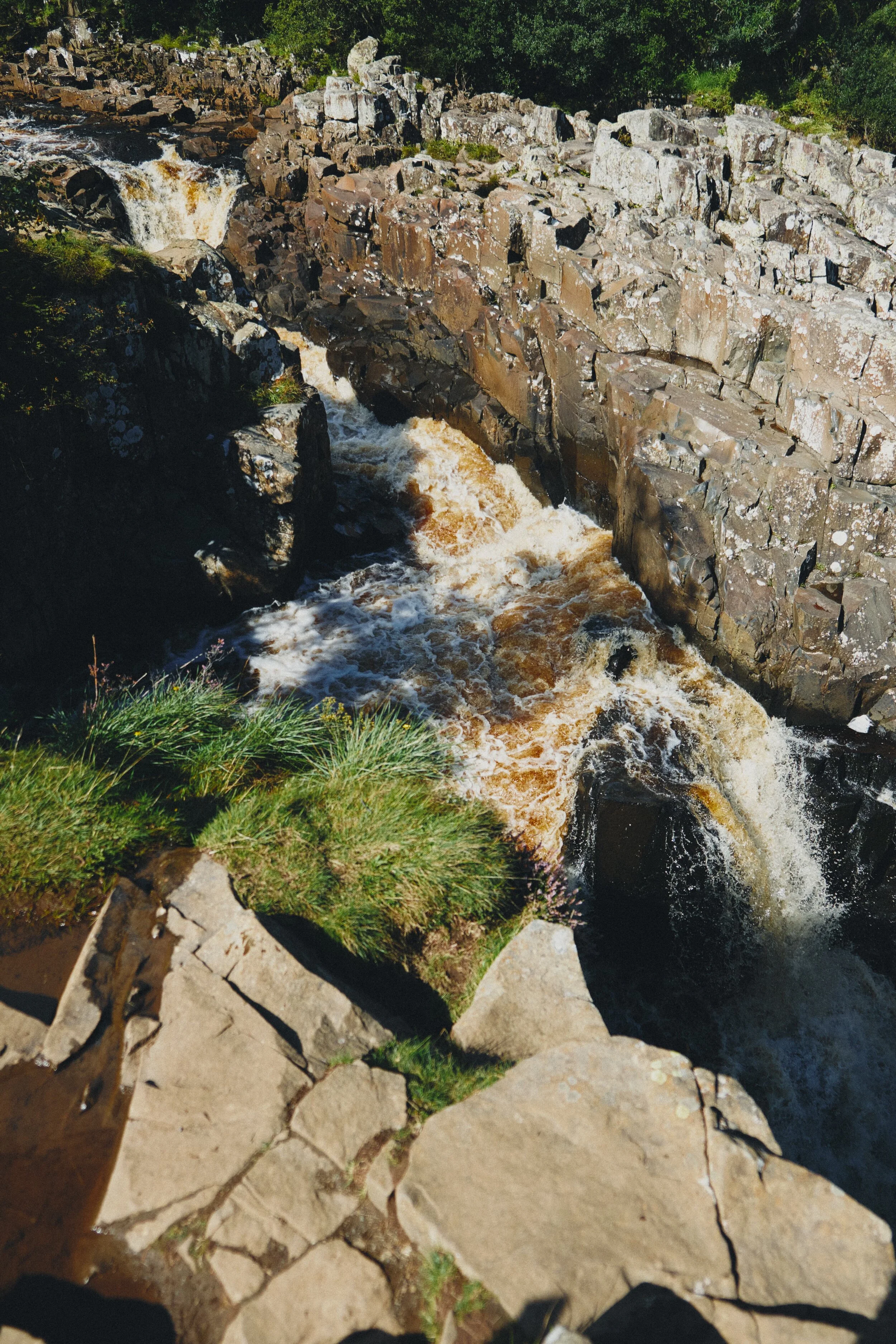 Looking straight down the sheer 70 ft drop of High Force. Definitely a weak-knee moment.