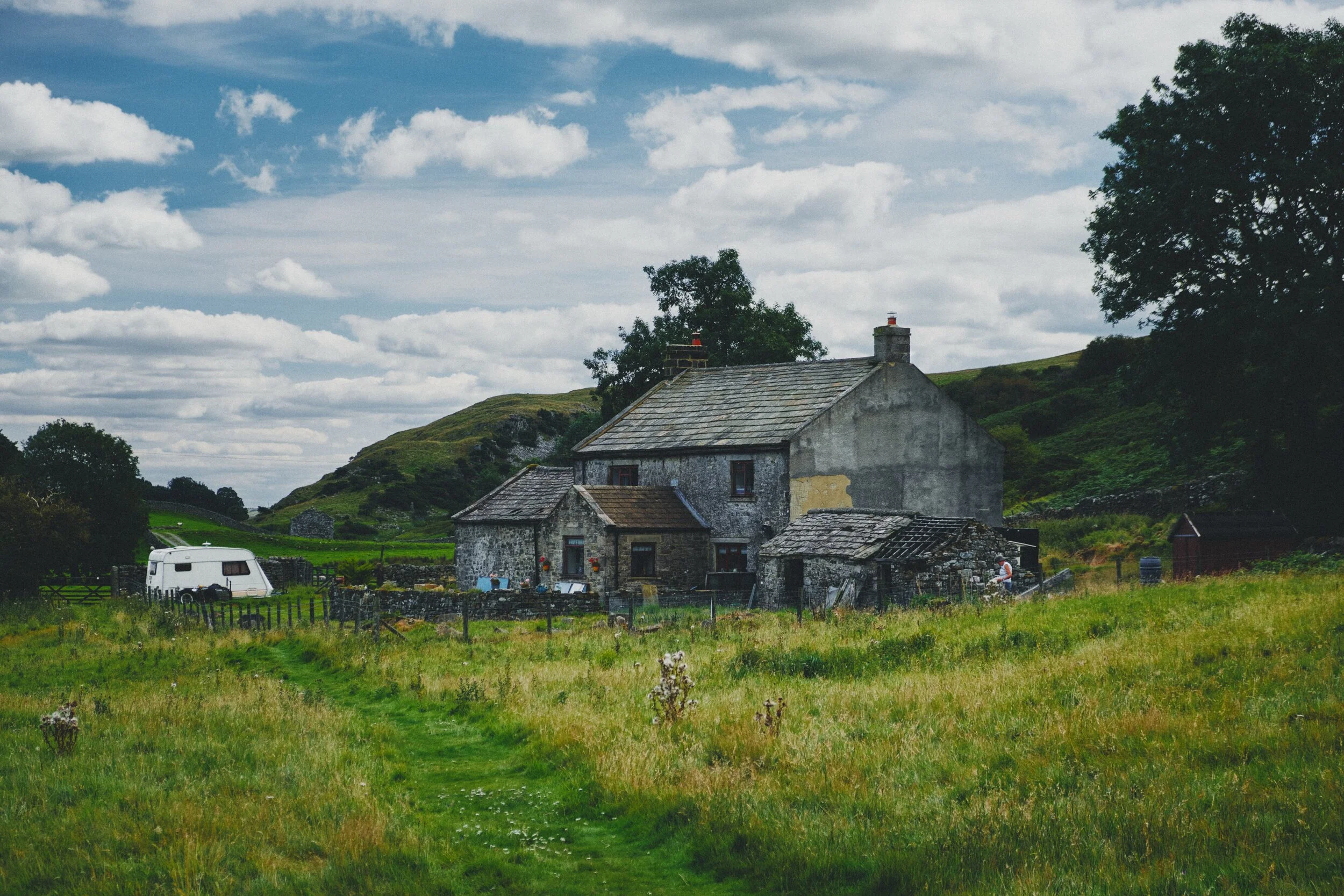 A somewhat rundown farmstead, still apparently in habitation.