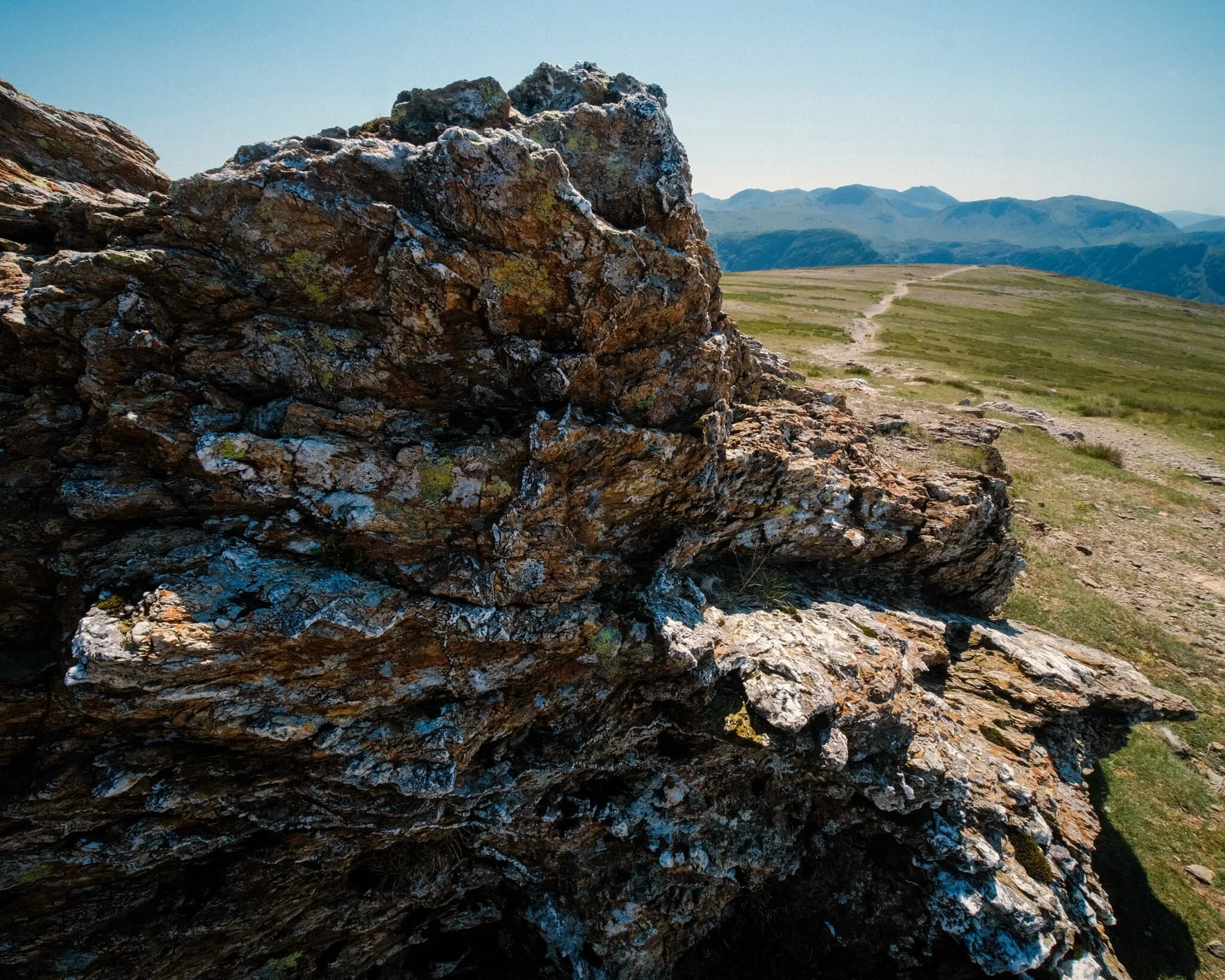 Utilising our previous route as a leading line towards the fells and featuring this wonderful craggy formation.