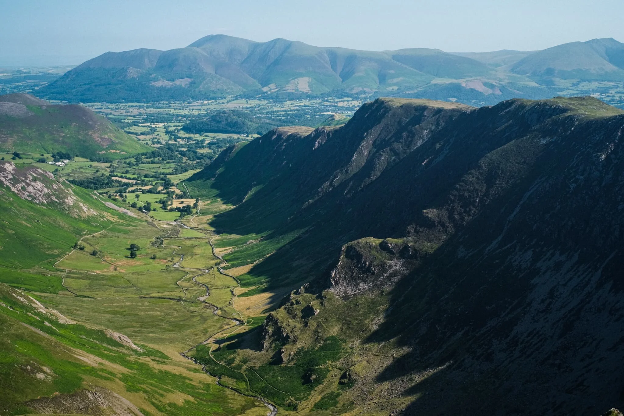 Probably my favourite shot of the day. The High Spy and Maiden Moor ridge, with its western flanks dropping sheer to the valley floor in a series of crags. In the distance, the Skiddaw range. Incredible.