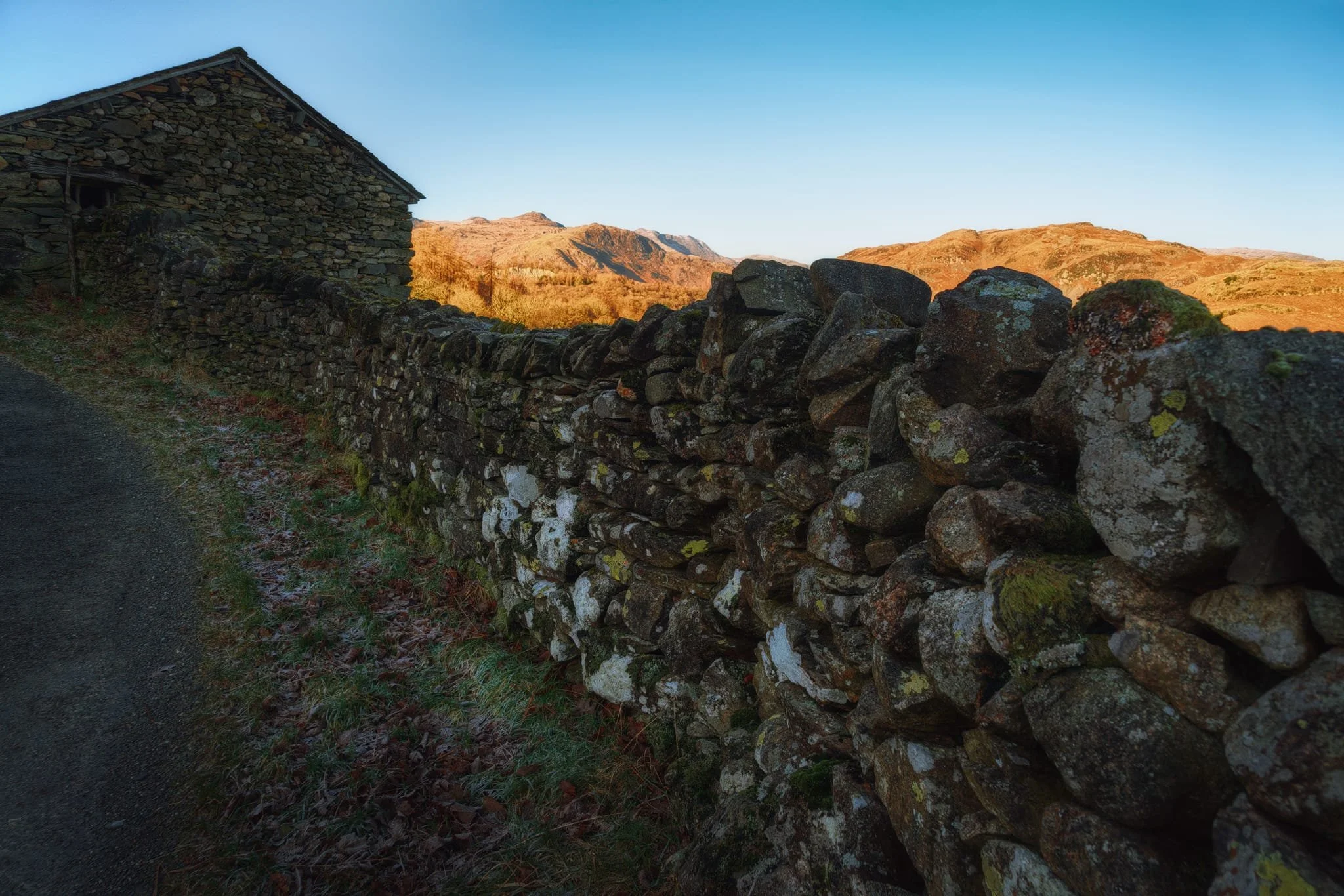  Around High Oxen Fell this lovely barn provided me this composition of the drystone wall leading to the combined skylines of the barn and the distant fells. 