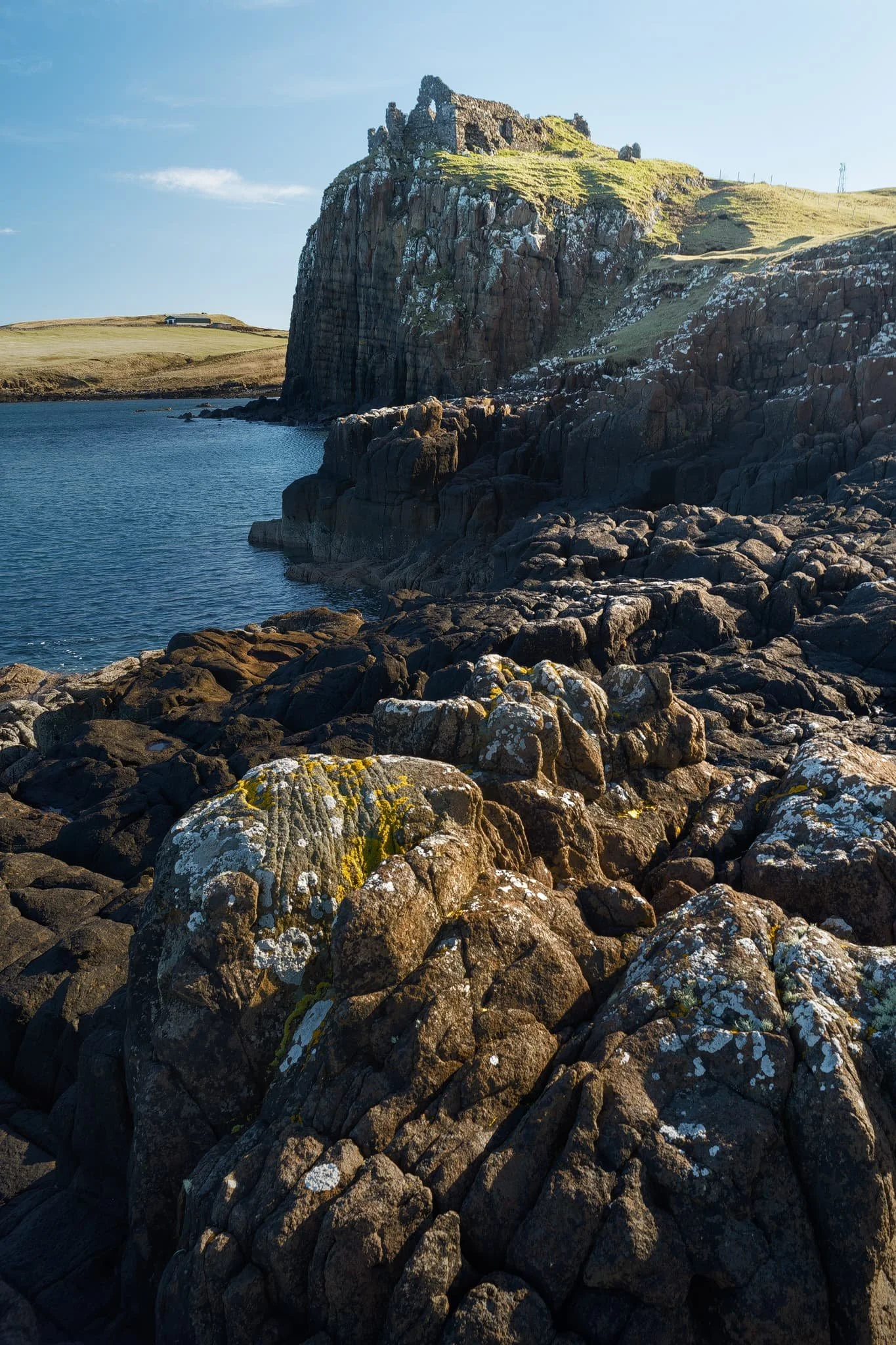 The epic ruins of Duntulm Castle, perched on top of basalt cliffs nearly 100ft above the surf. Southwest of the ruins, the coast is made of volcanic sill intrusions, criss-crossing joints that make for wonderful compositions.