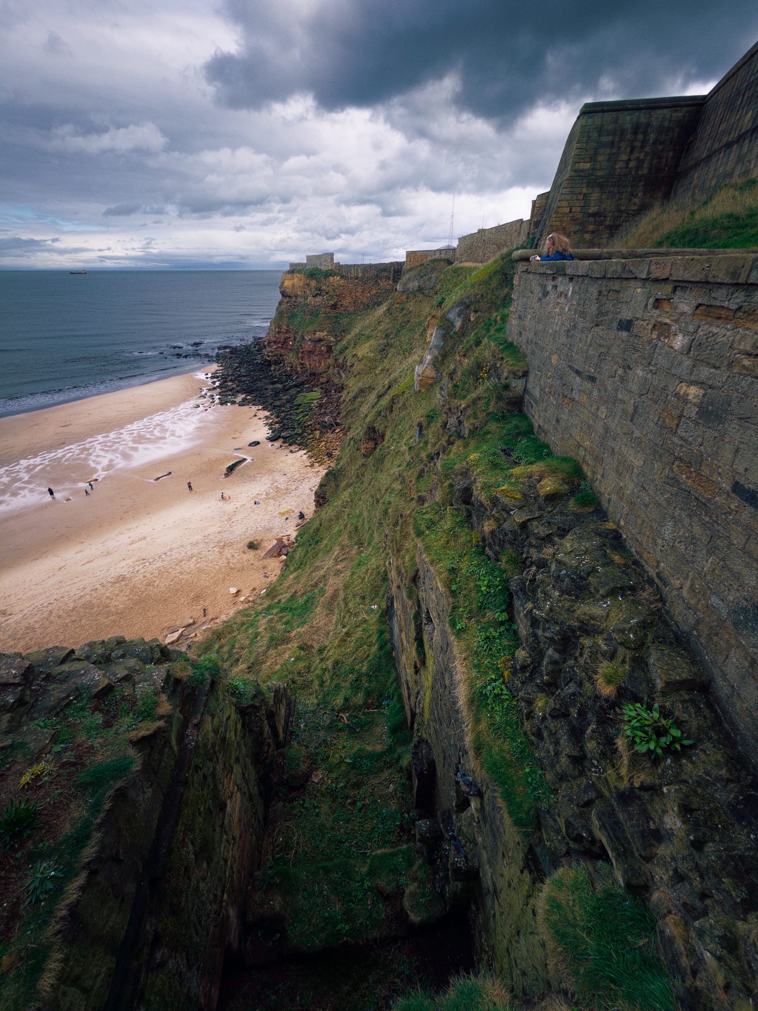 From the walls of the Priory, looking straight down the crag’s cliffs to King Edward’s Bay.