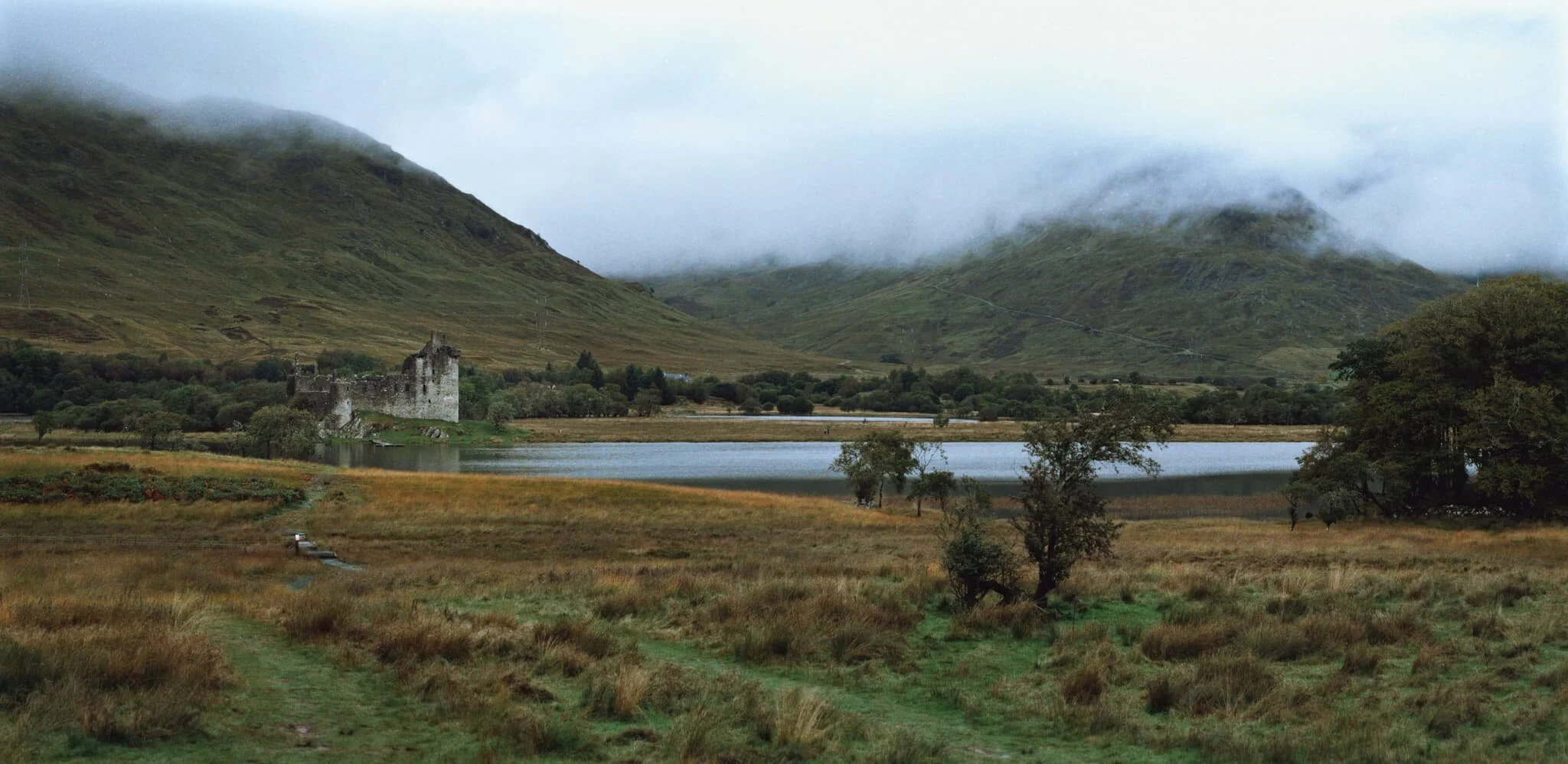 Beyond the northwestern corner of the Loch Lomond & the Trossachs National Park, one can find the shores of Loch Awe and the mighty peak of Ben Cruachan (1,126 m/3,694 ft). Below the mountain lies the ruins of Kilchurn Castle, originally constructed in the 15th century as the base of the Campbells of Glenorchy. I shot this 9-image panorama using my 55mm lens to really capture the mood and setting of this scene. 