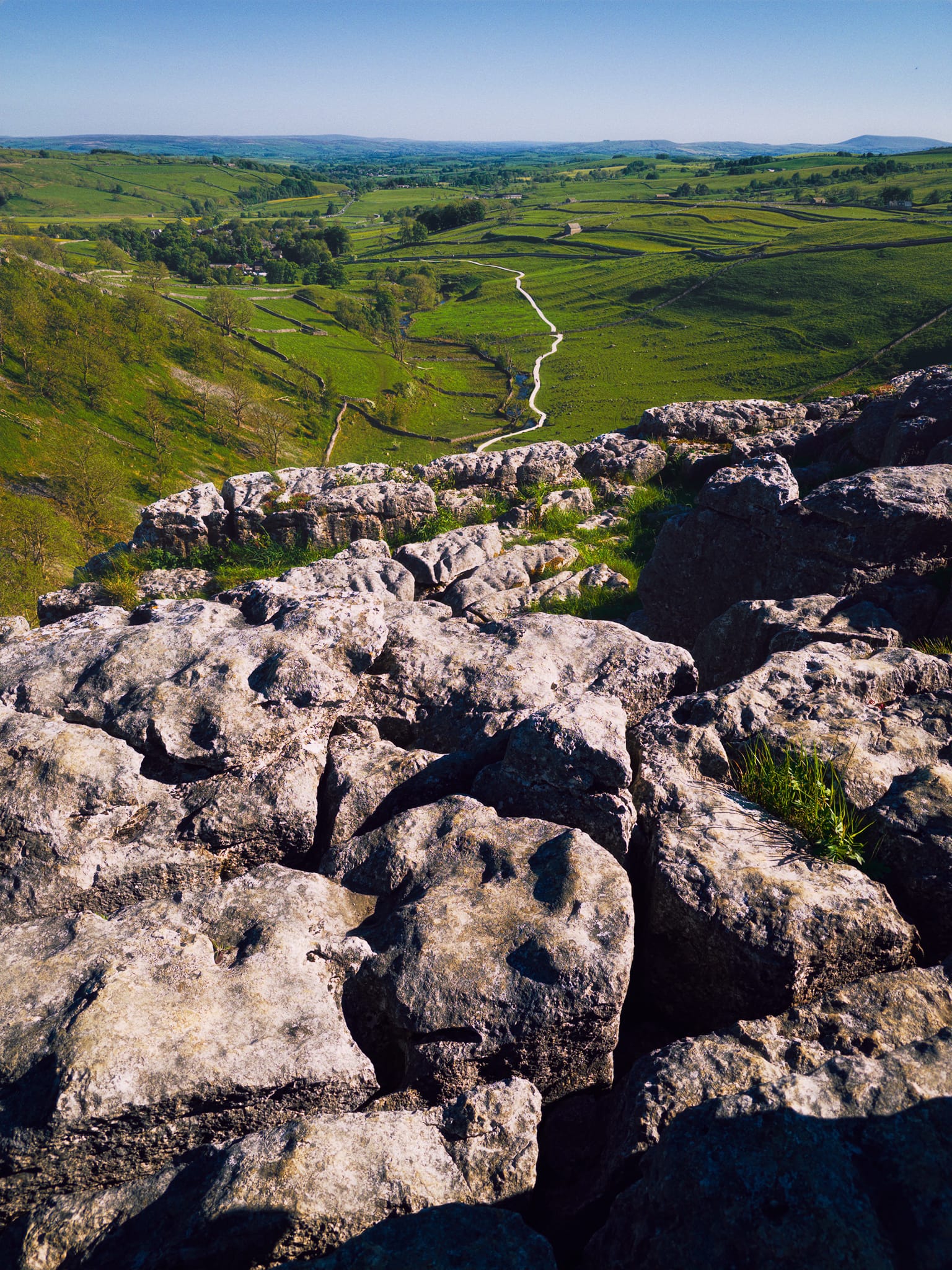 Finally we arrive at the top of Malham Cove and its expansive limestone pavement. Here, the prehistoric water racing from Watlowes would&rsquo;ve dropped down Malham Cove in what surely would&rsquo;ve been one of Europe&rsquo;s biggest waterfalls: 80 m (260 ft) high and more than 300 m (980 ft) wide.