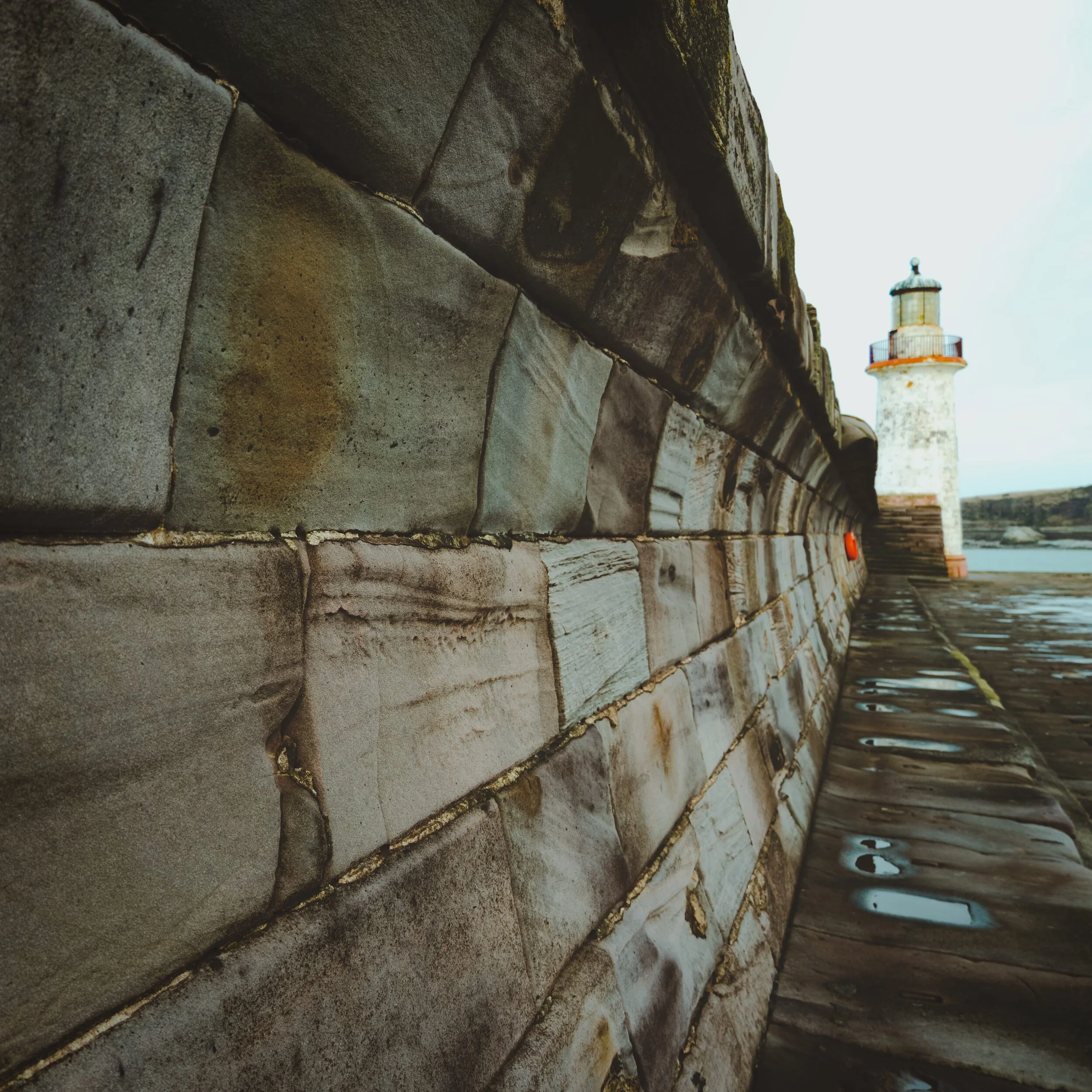 West Pier Lighthouse at Whitehaven. The curved walls of the pier&rsquo;s breakwaters intrigued me enough to feature them in a wider composition. I think it&rsquo;s alright. 