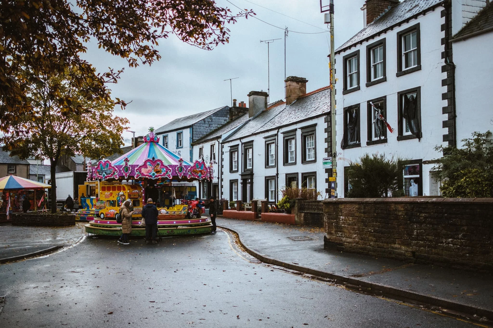  There&rsquo;s something wonderfully incongruous about colourful fairground rides juxtaposed with old monochrome stone houses. 